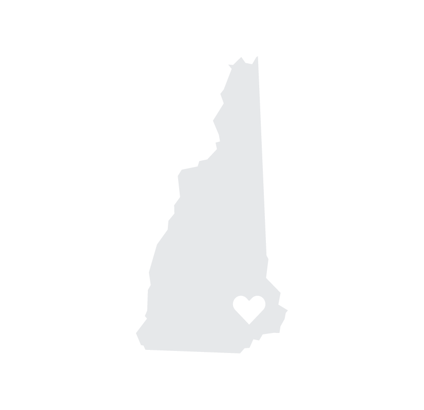 Silhouette outline of the state of New Hampshire with a black heart symbol near the southern part of the state.