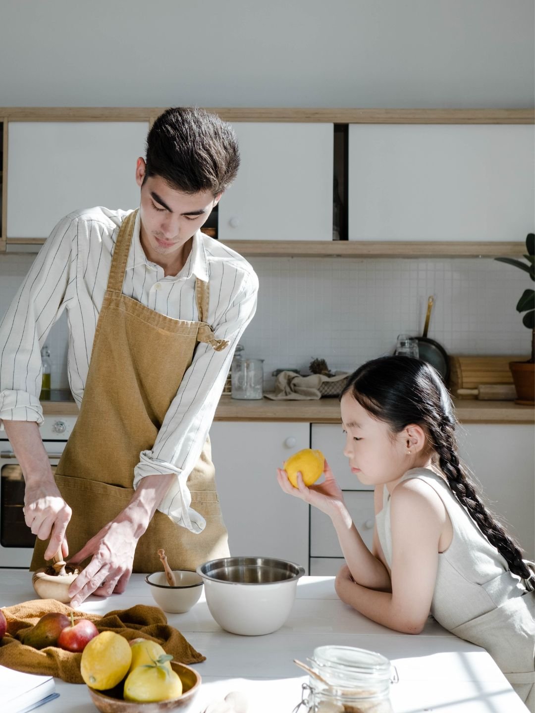 Dad and daughter cooking together