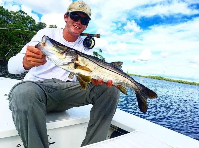 Snook caught on fly rod in Islamorada, Florida Keys. Backcountry fishing charters offer anglers exciting opportunities for snook, tarpon, and redfish year-round.