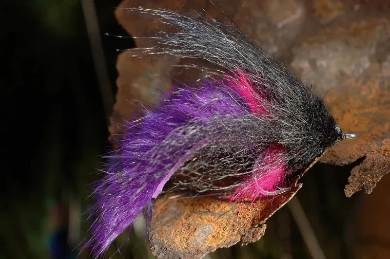 This vibrant purple and black tarpon fly delivers lifelike movement in the water, creating an irresistible swimming action that draws explosive strikes. These are Tied by SandS Flies and my favorites are the black and purple and the chartreuse.