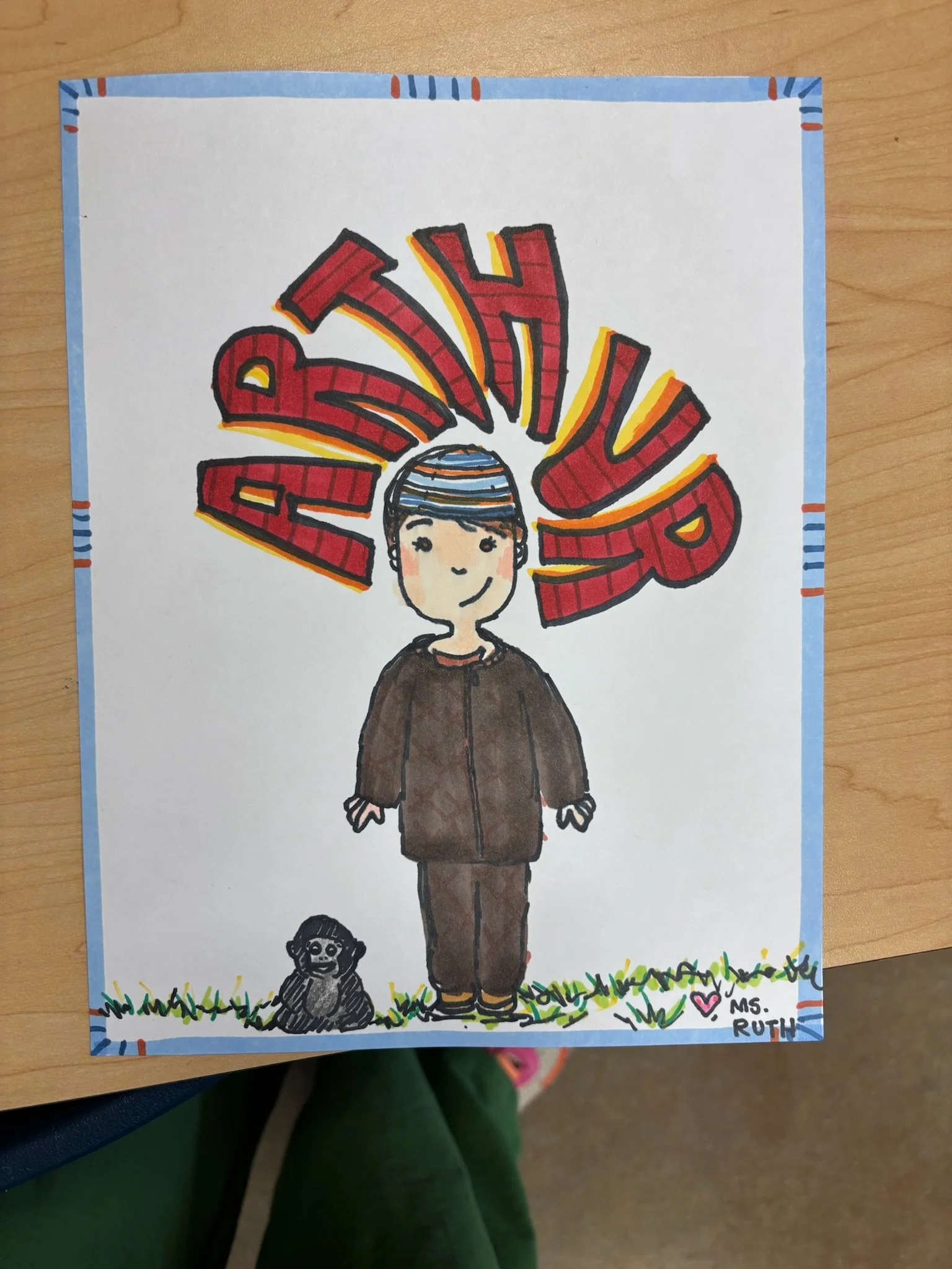 Child in brown clothing standing on grass with a small black dog at their feet. Behind them, large red letters spell 'BABY' in a fan shape. The artist signed it 'Ms. Ruth' in the bottom right corner.