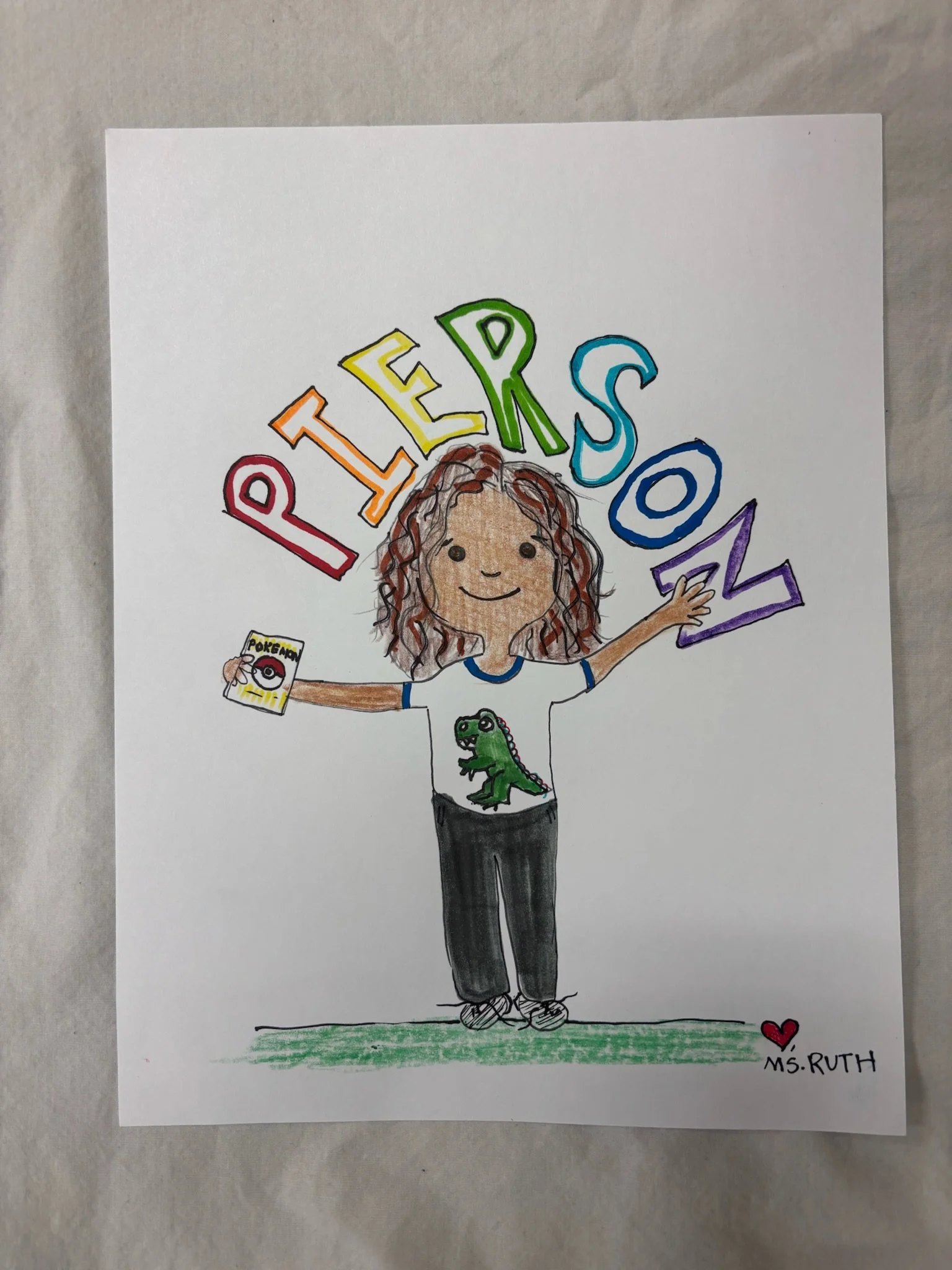 Colorful drawing of a girl with curly hair holding a Pokémon card in one hand and reaching out with her other hand. The word 'PETERS' is spelled out above her in rainbow colors. She is wearing a T-shirt with a green dinosaur on it and gray pants. The