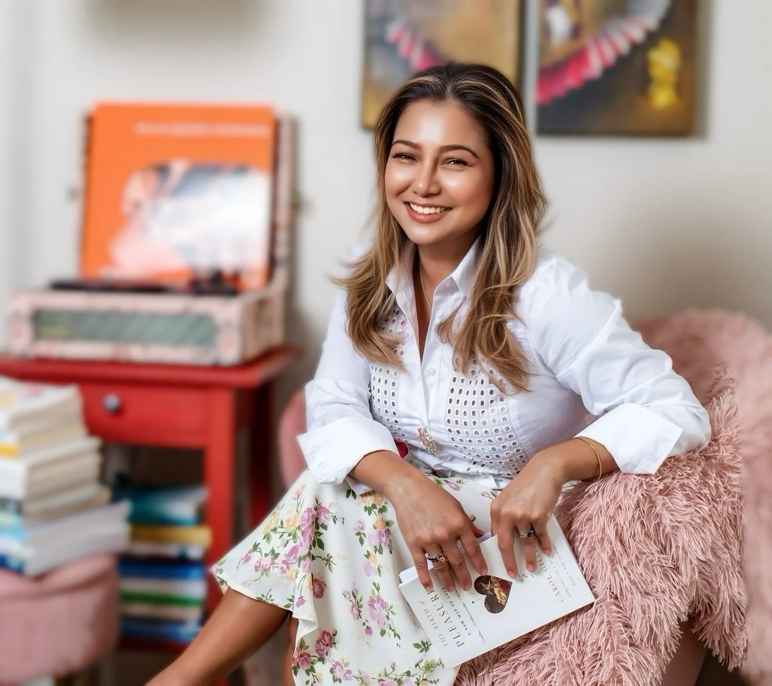 Therapist’s office with warm, vintage décor and soft pink tones — representing emotional safety and connection