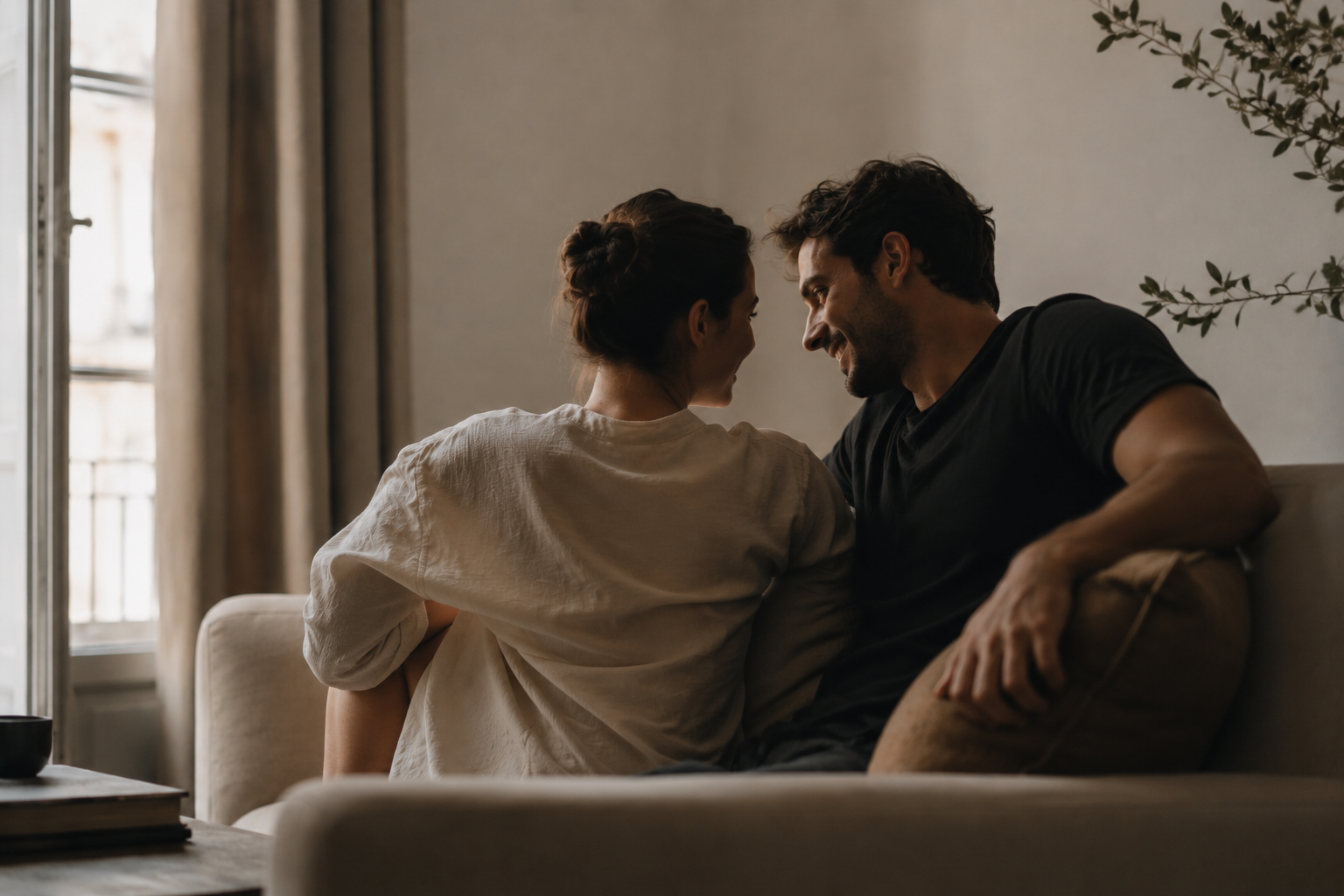 Couple sitting closely together during a couples therapy intensive focused on emotional connection and repair.