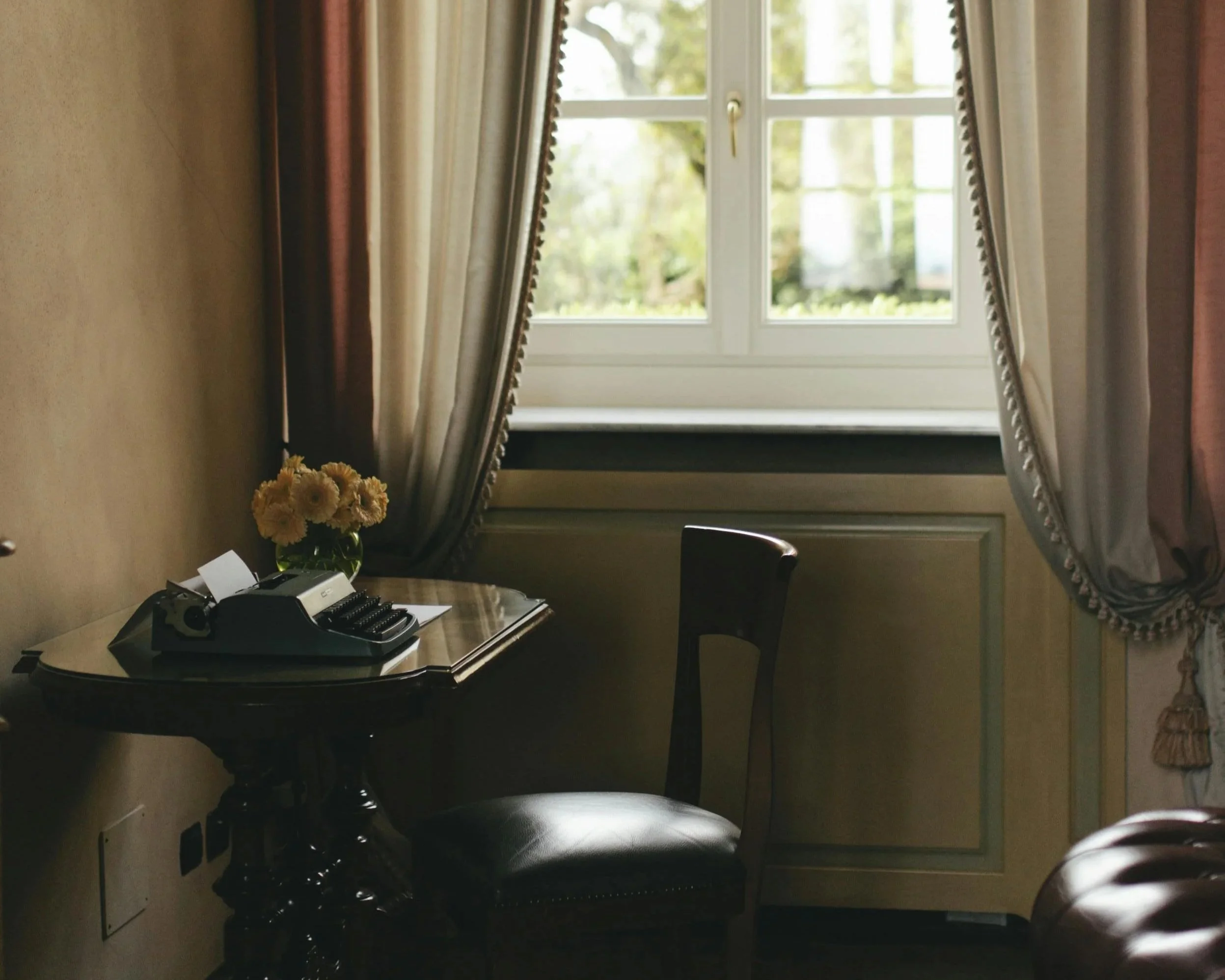 Vintage writing desk symbolizing reflection, storytelling, and thoughtful therapy.