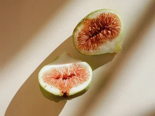 Halved fig in sunlight