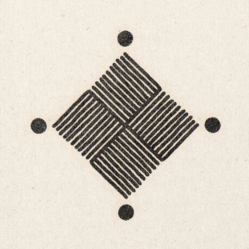 Woven diamond symbol with four dots