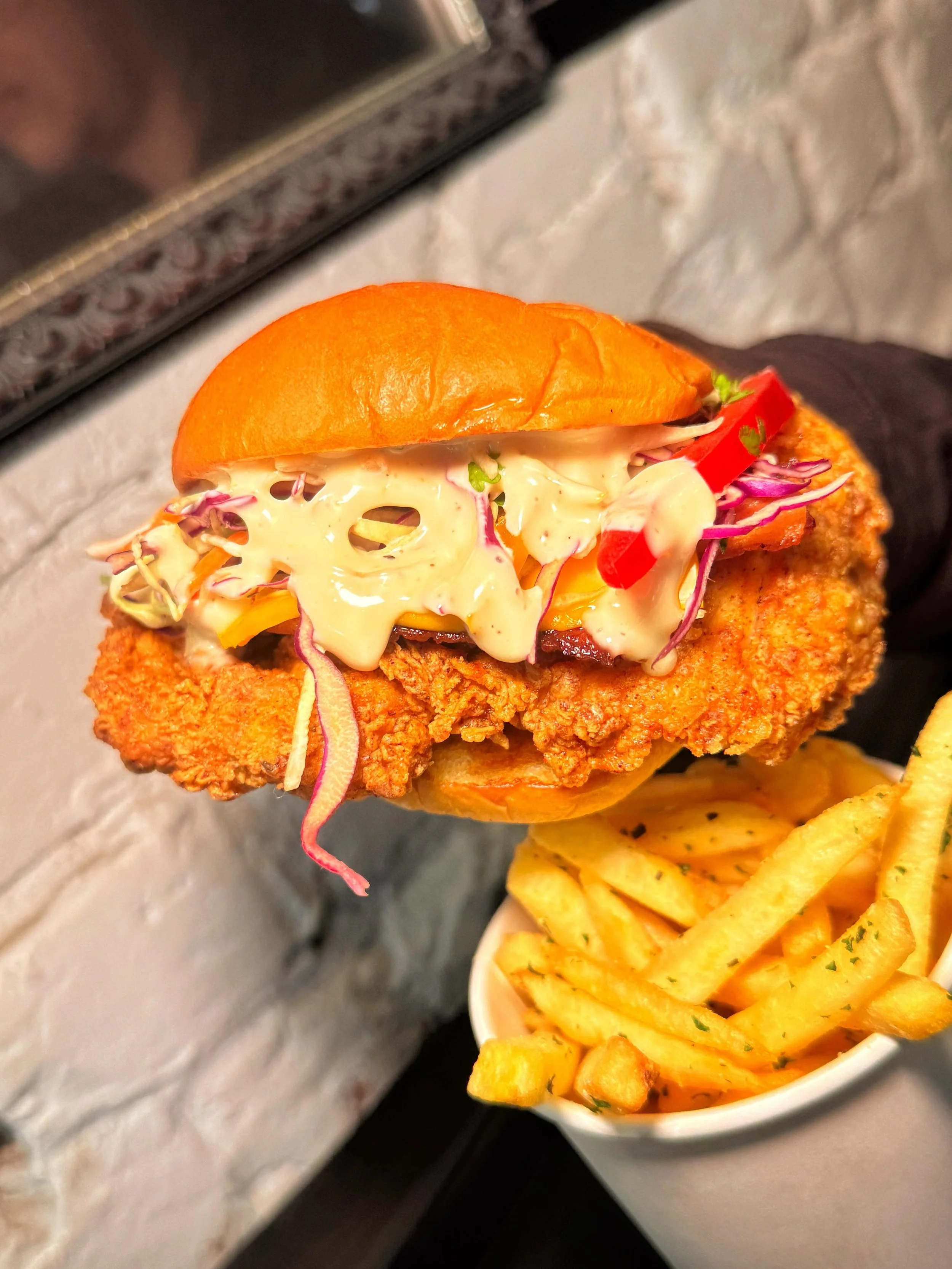 Crispy, juicy, and stacked with bacon and melted cheese, FRIED CHICKEN SANDWICH W/ BACON AND CHEESE is the ultimate handheld upgrade! 🍗🥓🧀
#SMASHEDNYC #NYC #NewYorkCity 
📍 516 Hudson St, NYC (West Village)
📍 94 3rd Ave, NYC (East Village)
📍 55 W
