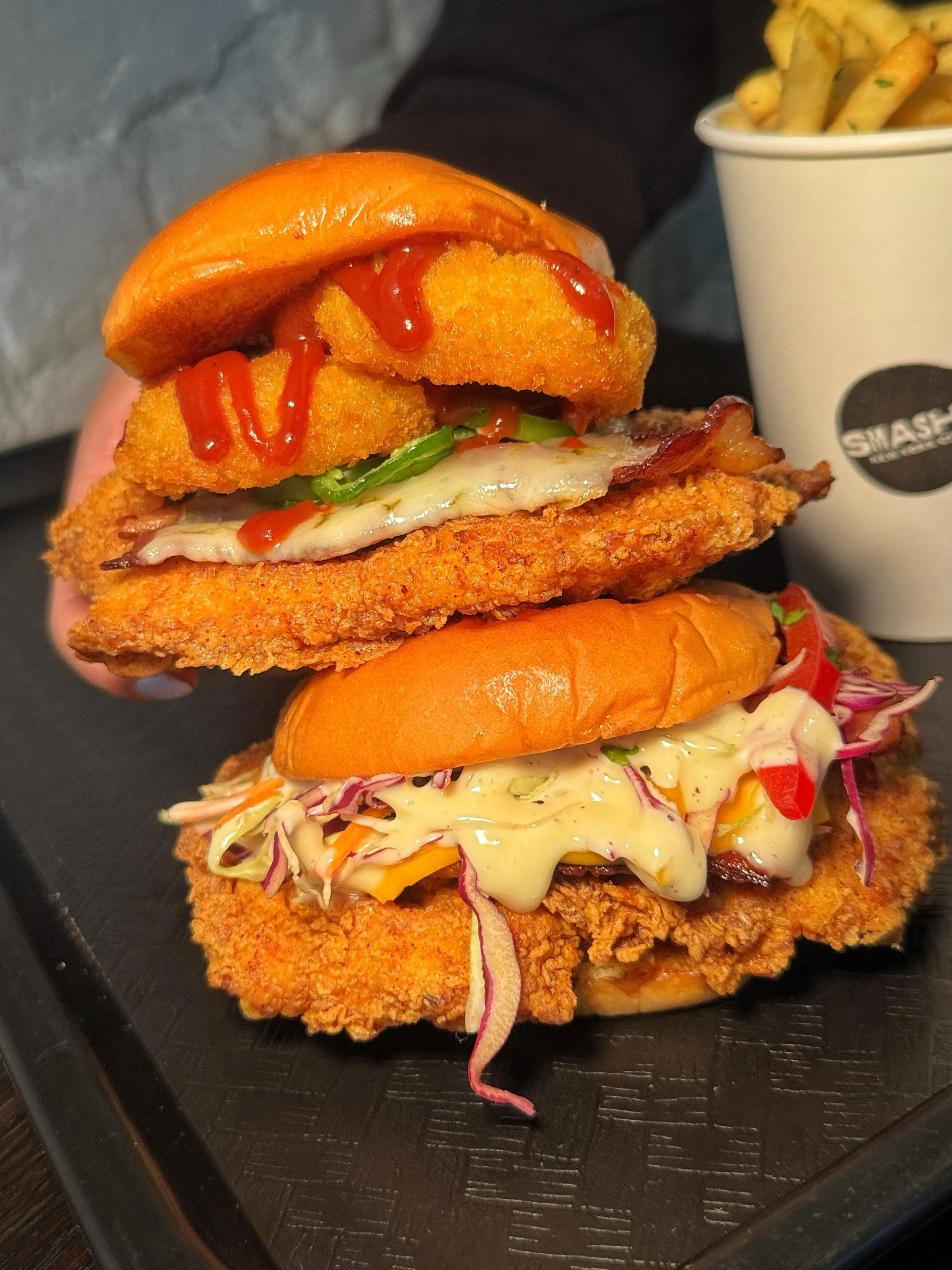 Join us this week and indulge in our signature CHICKEN SANDWICHES! 🍗😋💥
#SMASHEDNYC #NYC #NewYorkCity 
📍 516 Hudson St, NYC (West Village)
📍 94 3rd Ave, NYC (East Village)
📍 55 Water St, Brooklyn (Time-Out Market)
📍 124 E. 14th St, Manhattan (T