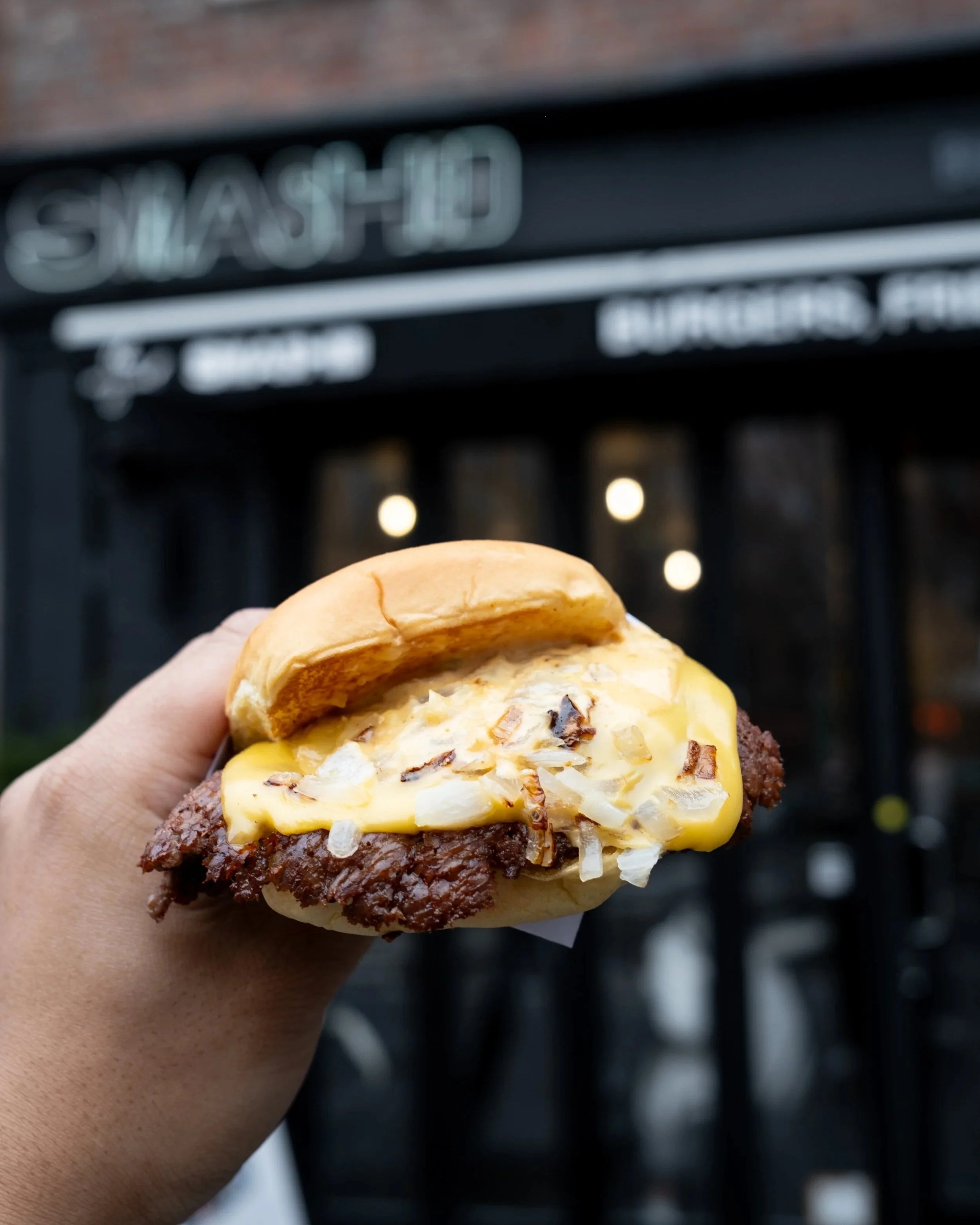 Classic smashed burger in front the SMASHED NYC West Village