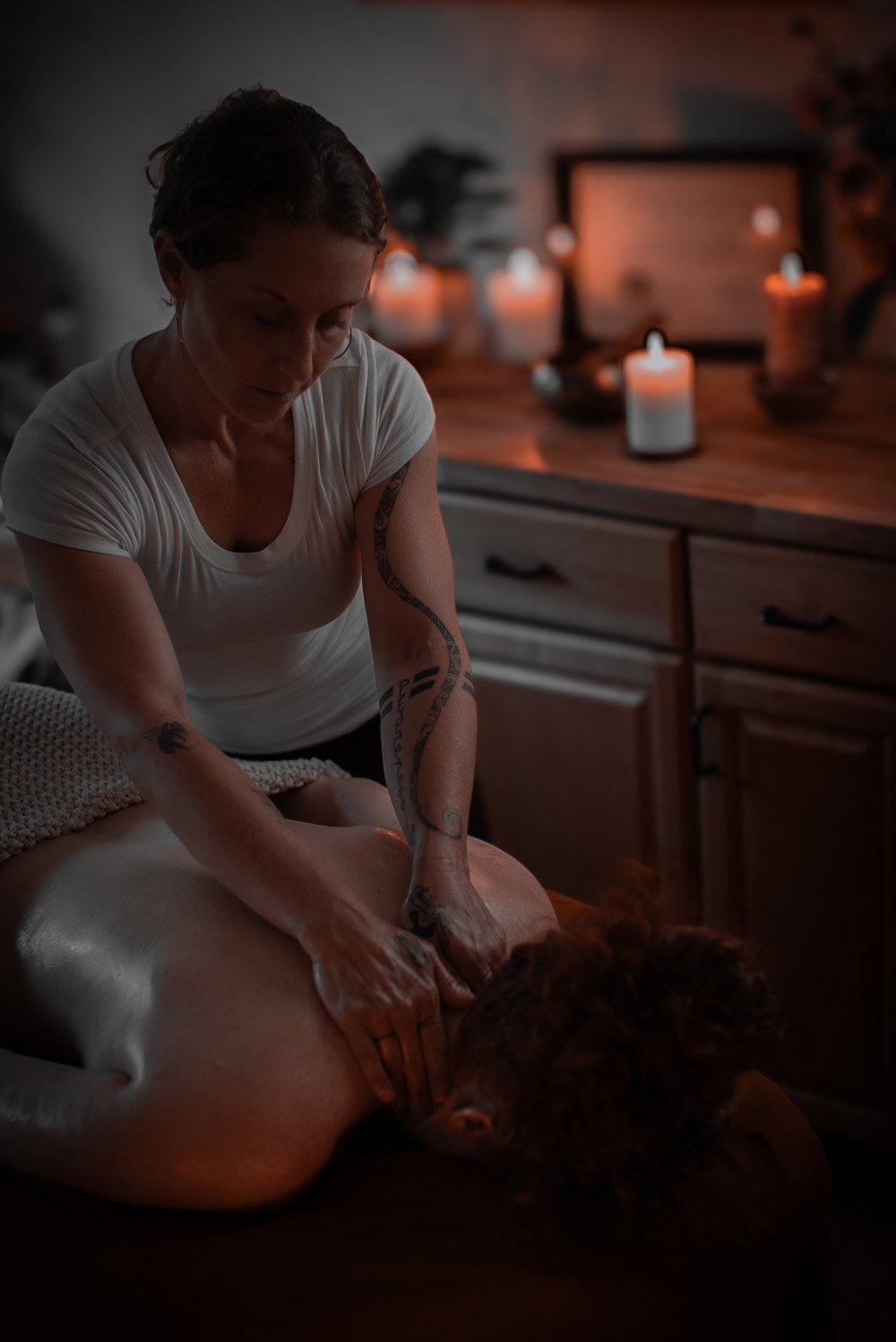 Kele Bodyworks massaging client's neck