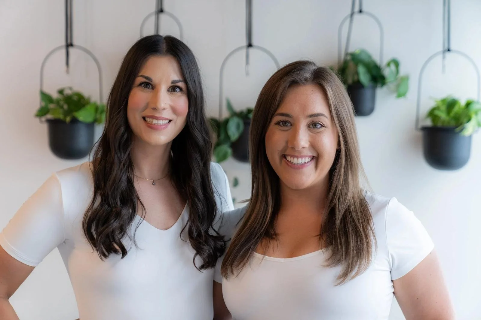 Dr. Courtney Rose and Dr. Taylor Wenrick, chiropractors at InnerLux Healing Collective in Denver