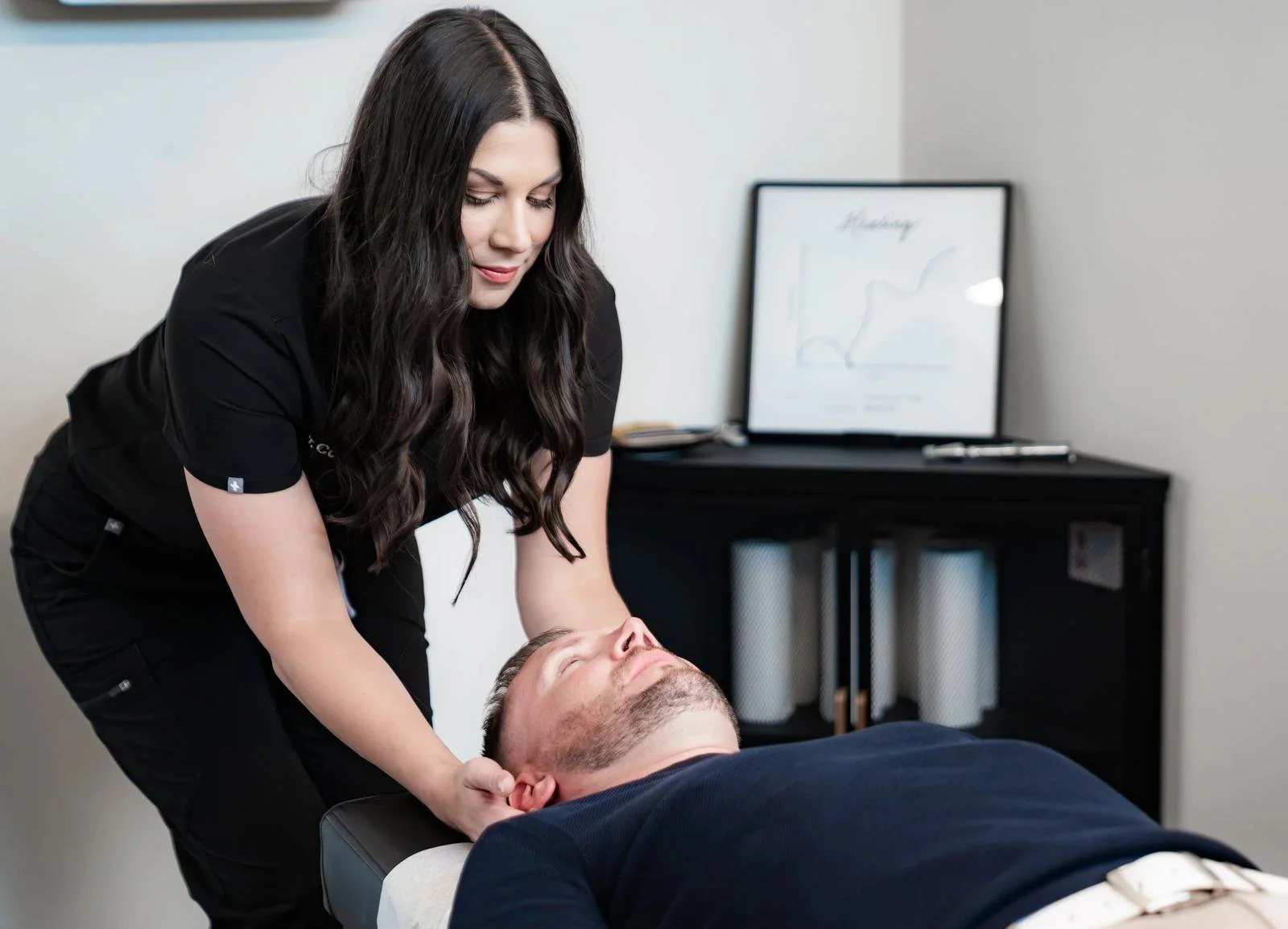 Chiropractor adjusting a patient during structural chiropractic care in Denver