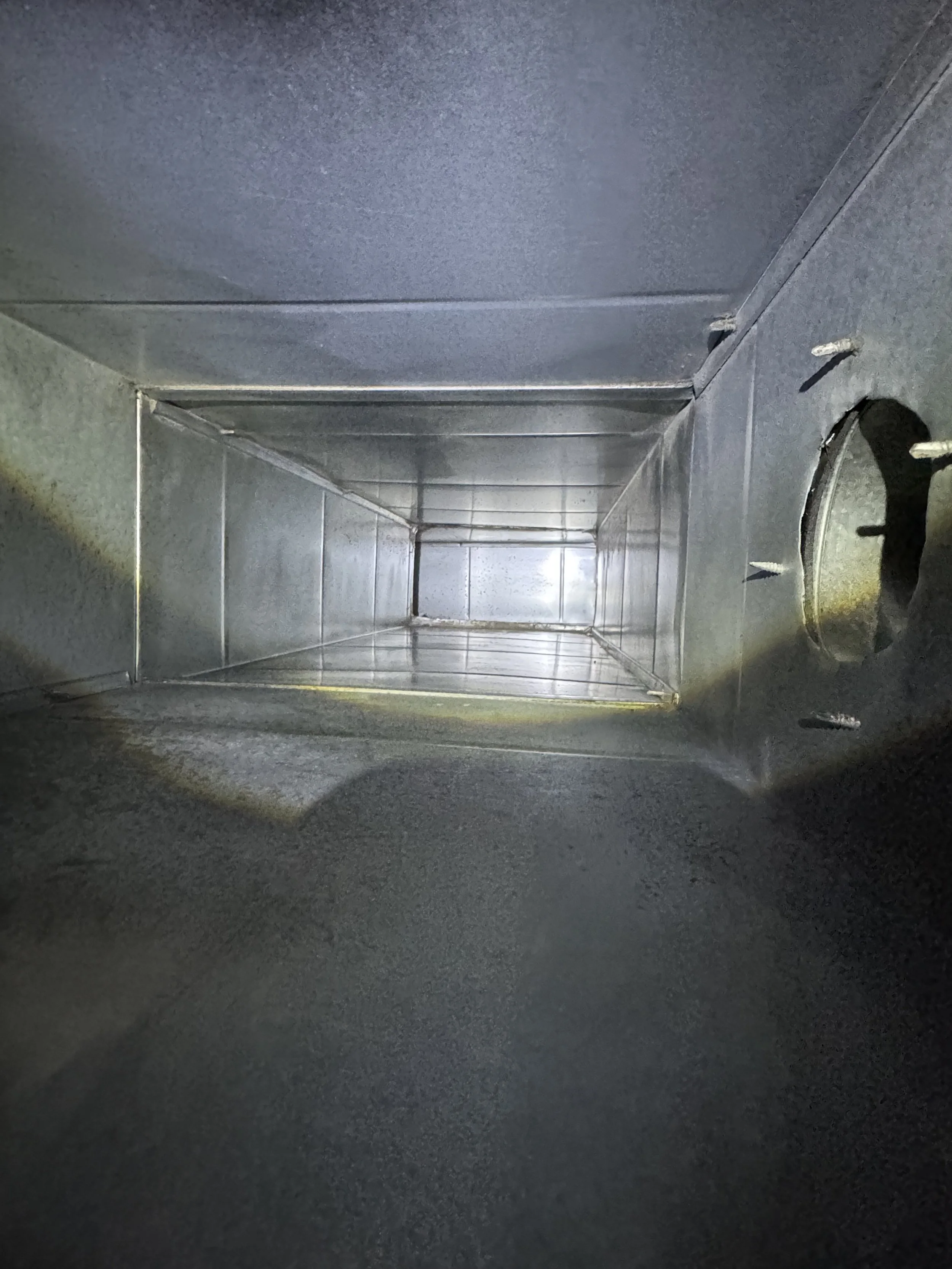 Inside view of a metallic rectangular duct or vent.