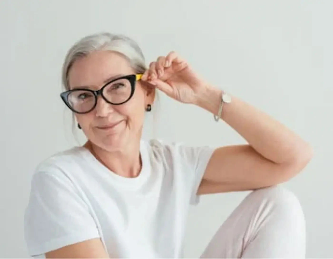 Confident senior woman enjoying a calm, clutter-free lifestyle after virtual decluttering support