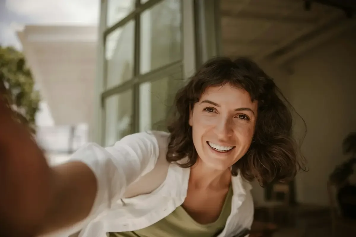 Smiling woman representing compassionate, judgment-free decluttering support for neurodivergent women