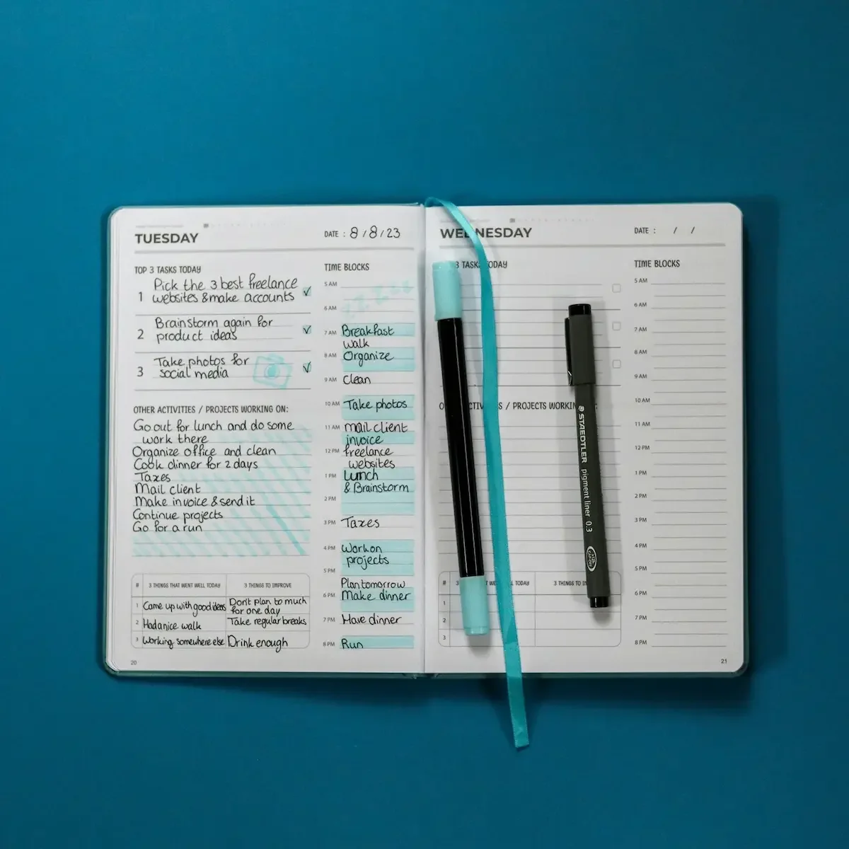 Open planner and pen representing clear, step-by-step decluttering guidance that prevents overwhelm
