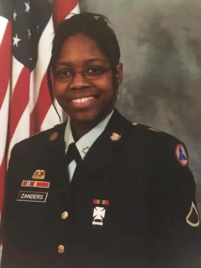Wendy Zanders in U.S. Army uniform, reflecting her background as a Unit Supply Specialist and Army veteran.
