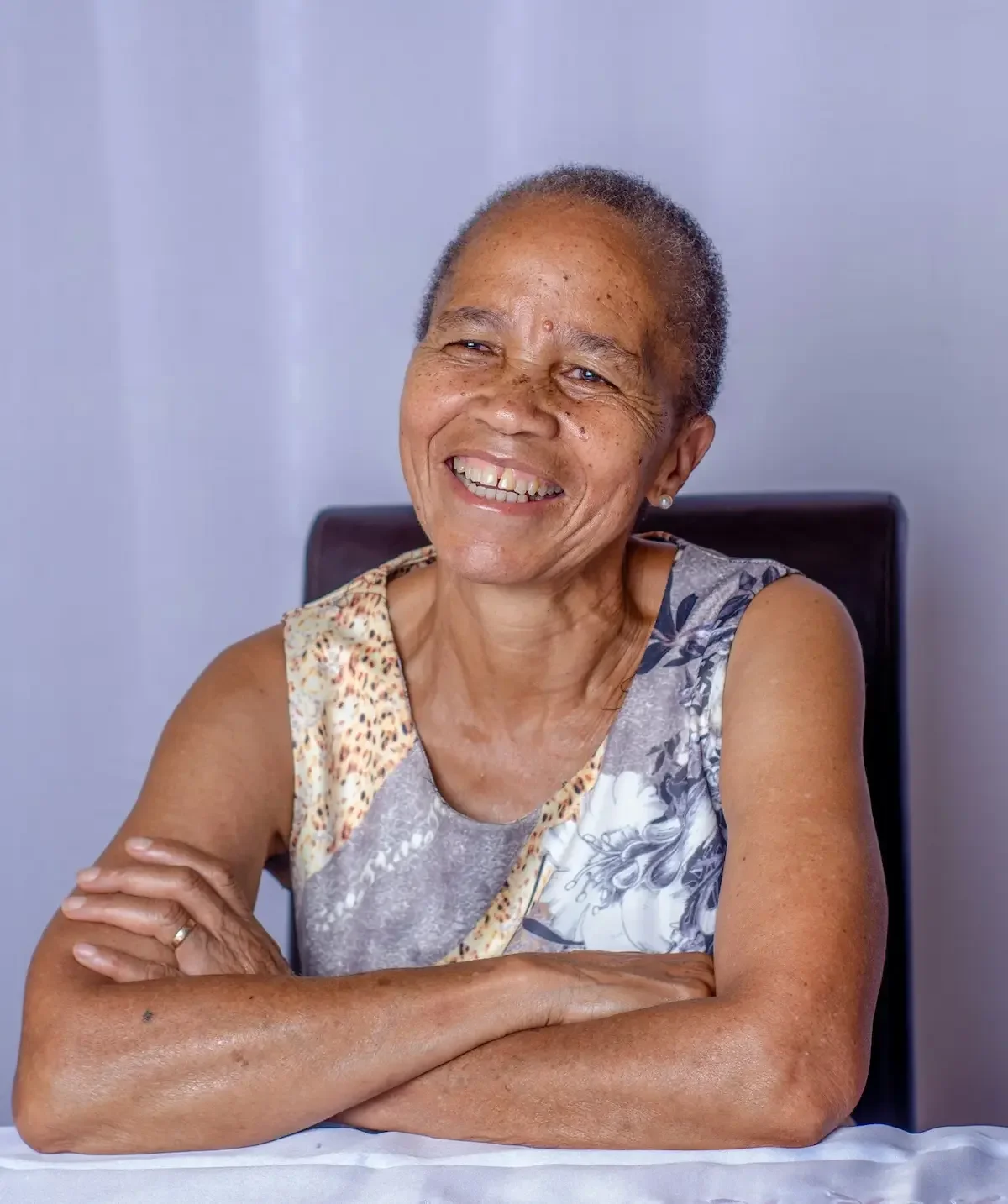 Smiling senior woman feeling confident and prepared for downsizing or a future life transition.