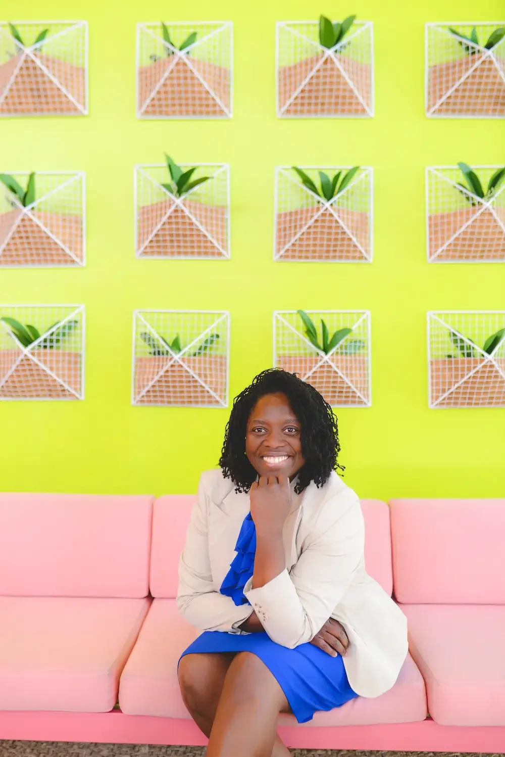 Wendy Zanders, virtual decluttering coach and professional organizer, smiling while seated in a bright, organized space.