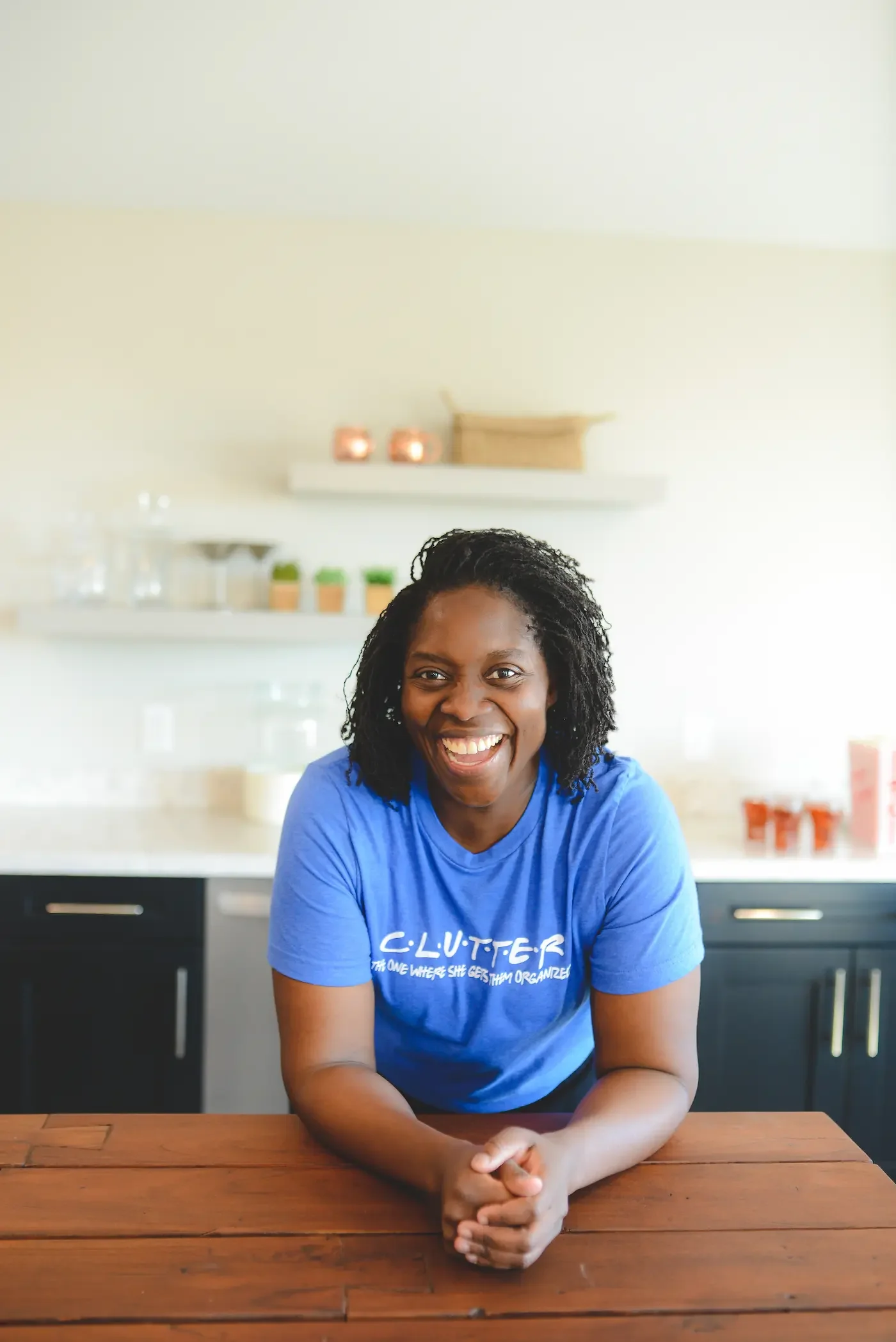 Wendy Zanders smiling warmly in her kitchen, offering compassionate support for neurodivergent individuals.