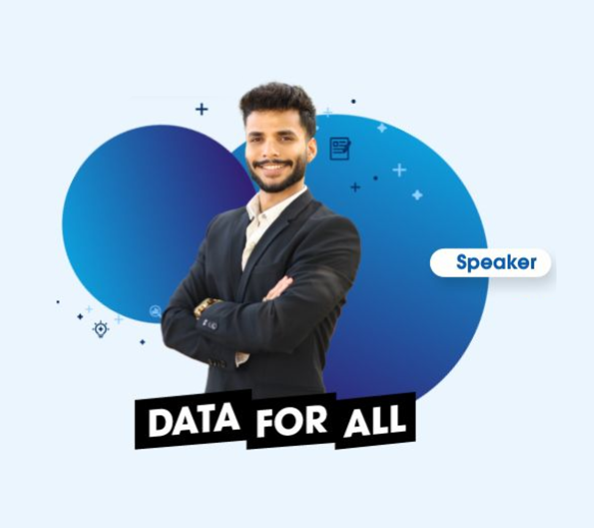 A man in a suit smiling with arms crossed, standing in front of a blue digital background with the text "Data for All" and a label "Speaker".