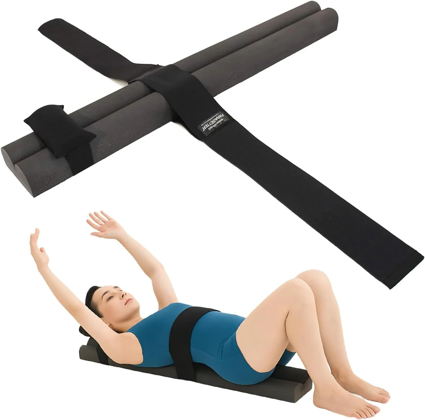 A woman lying on an anti-gravity medical inversion therapy table with a headrest, wearing a blue outfit and a waist strap, stretching with her arms raised.
