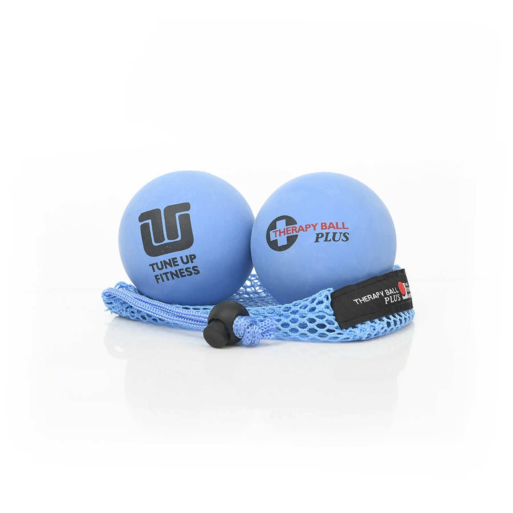 Two blue therapy balls labeled 'Tune Up Fitness' and 'Therapy Ball Plus' are placed on a white background, with a blue mesh carrying pouch.