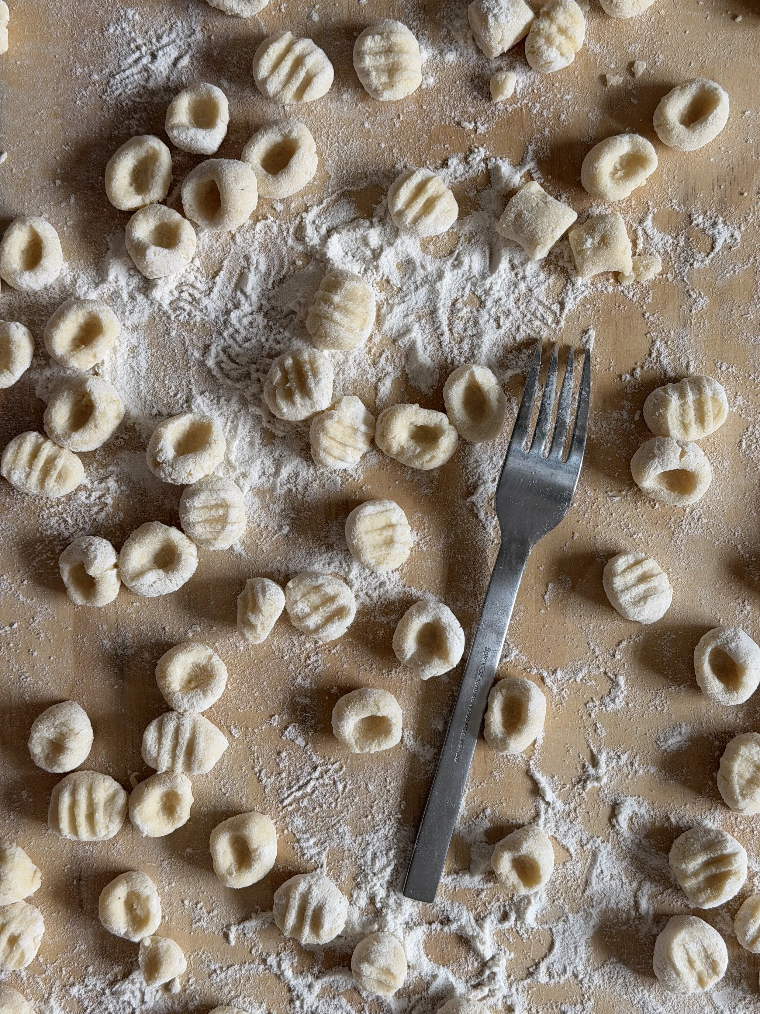 Geometric drawing of an outline square with sections divided by vertical, horizontal, and diagonal lines.