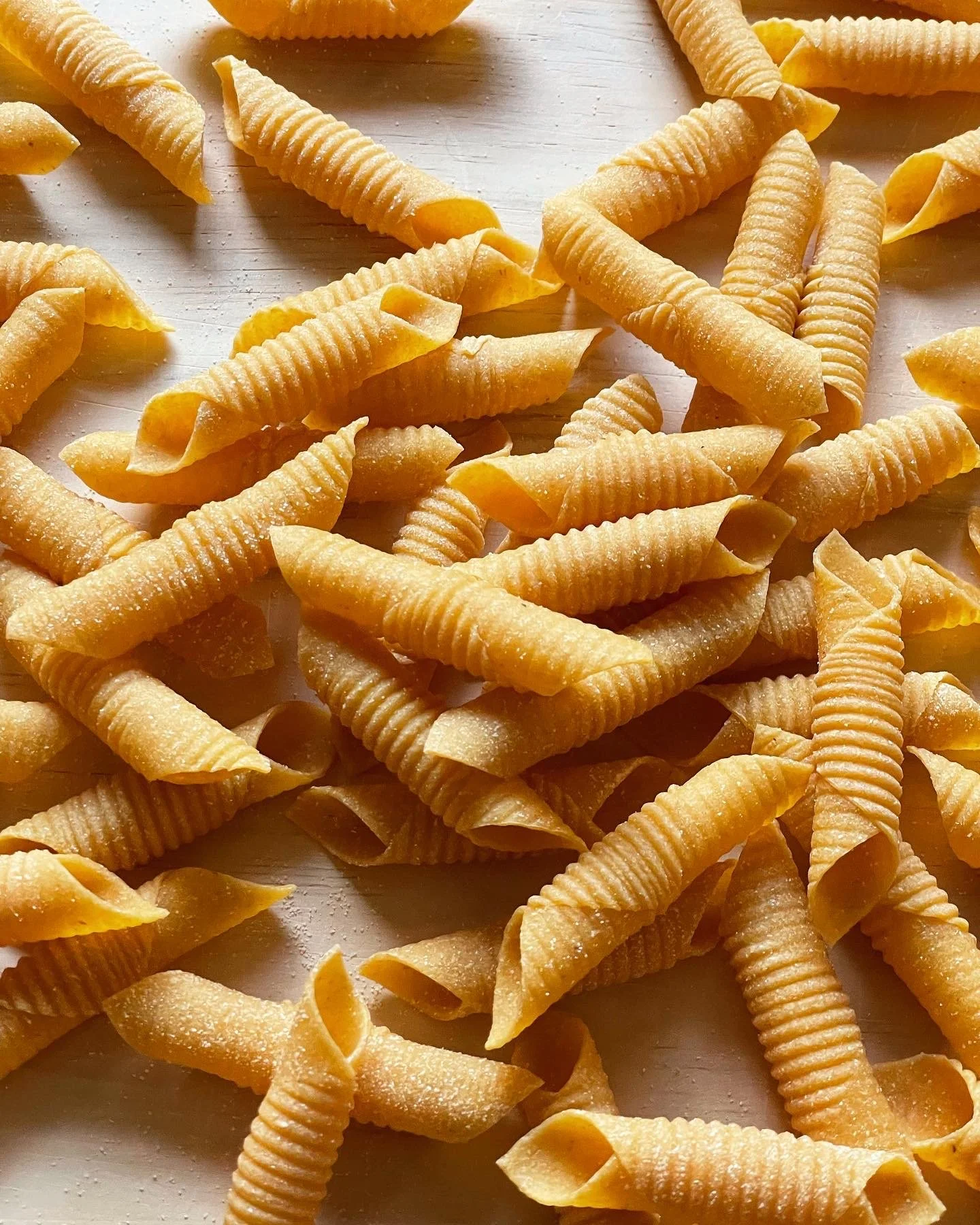 Geometric drawing of an outline square with sections divided by vertical, horizontal, and half circle lines.