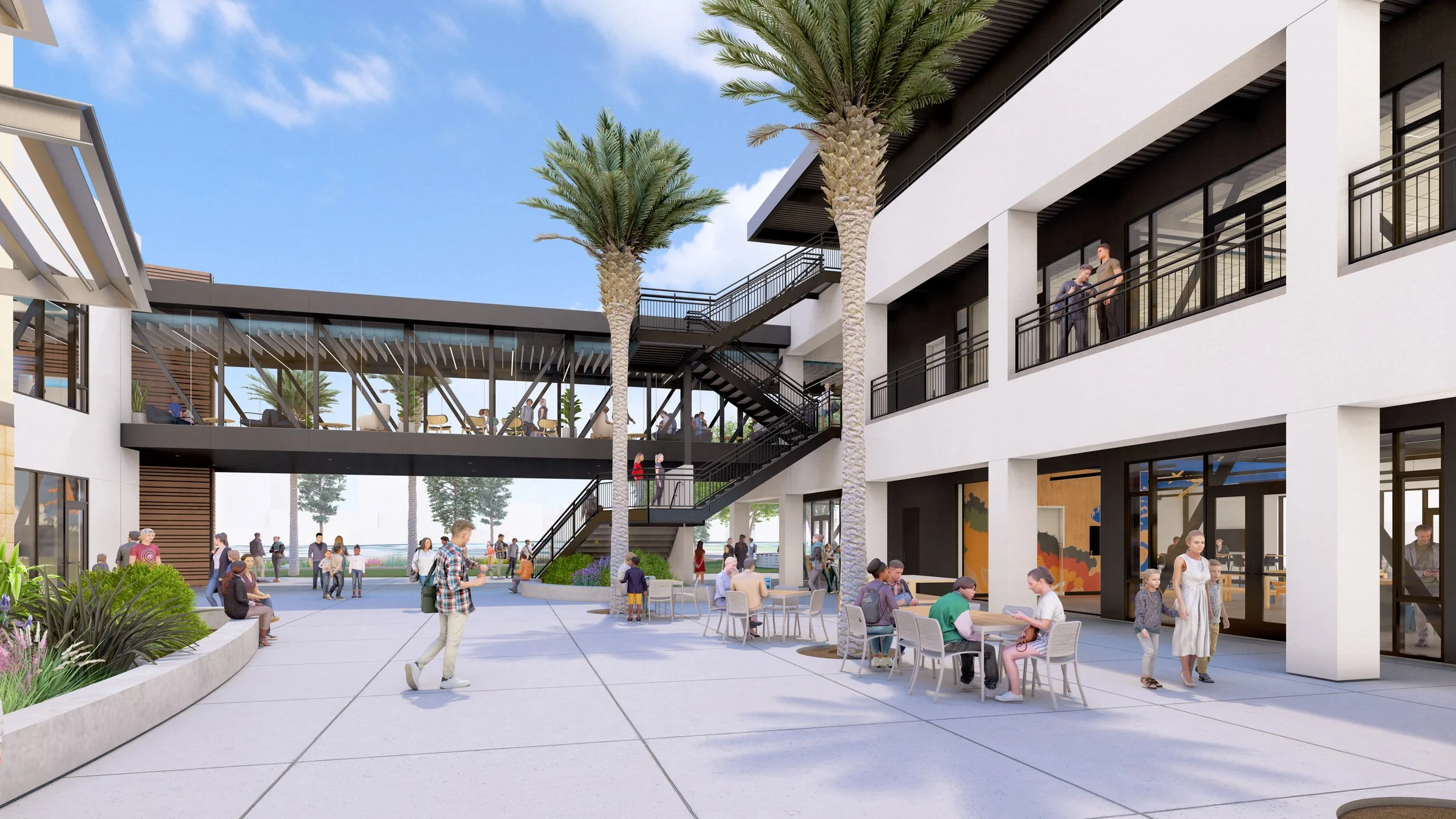Modern outdoor courtyard with people, palm trees, stairs, and glass walkway in commercial building complex under blue sky.