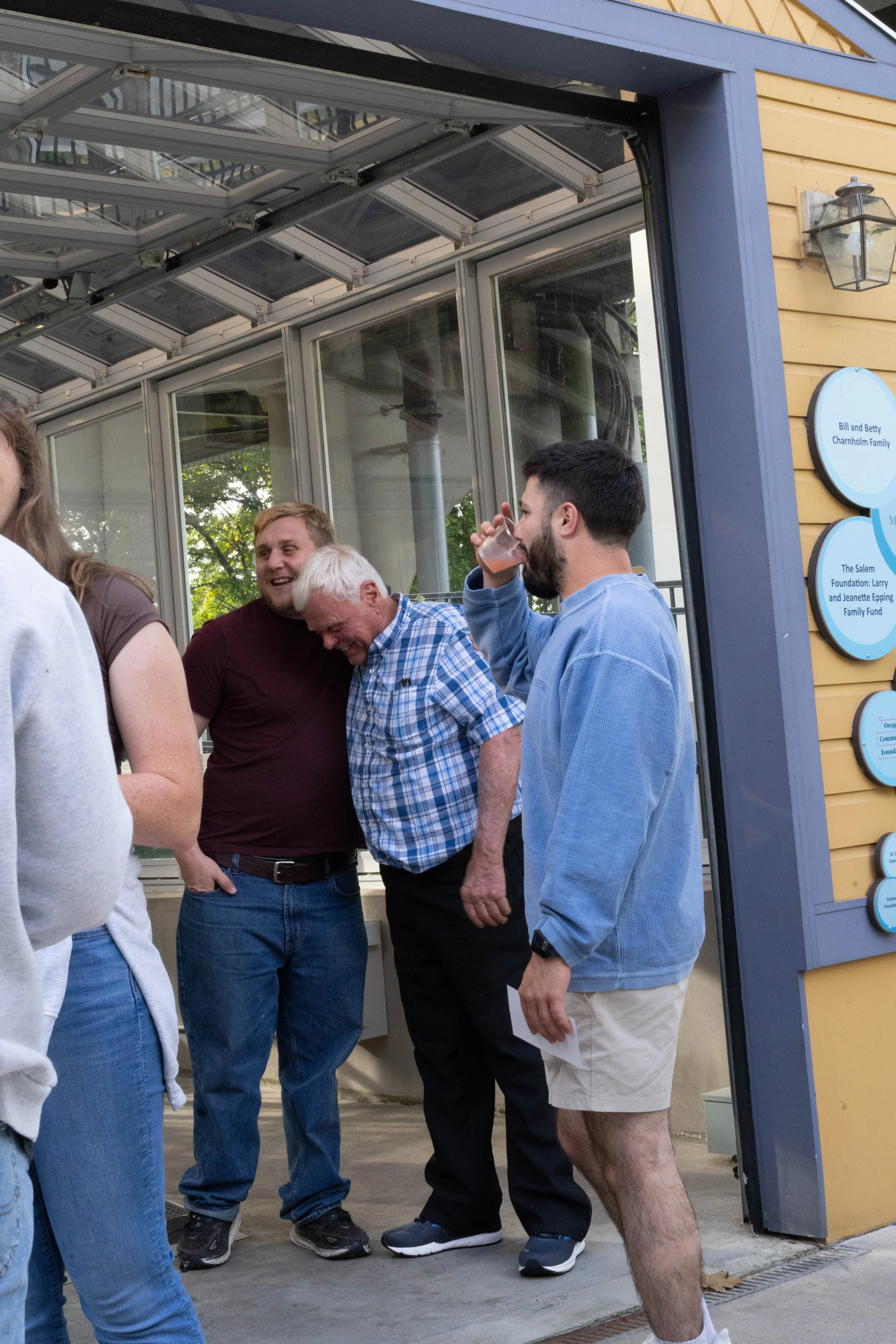 Evening rental guests mingling in the bubble factory to celebrate the completion of new museum mural work.