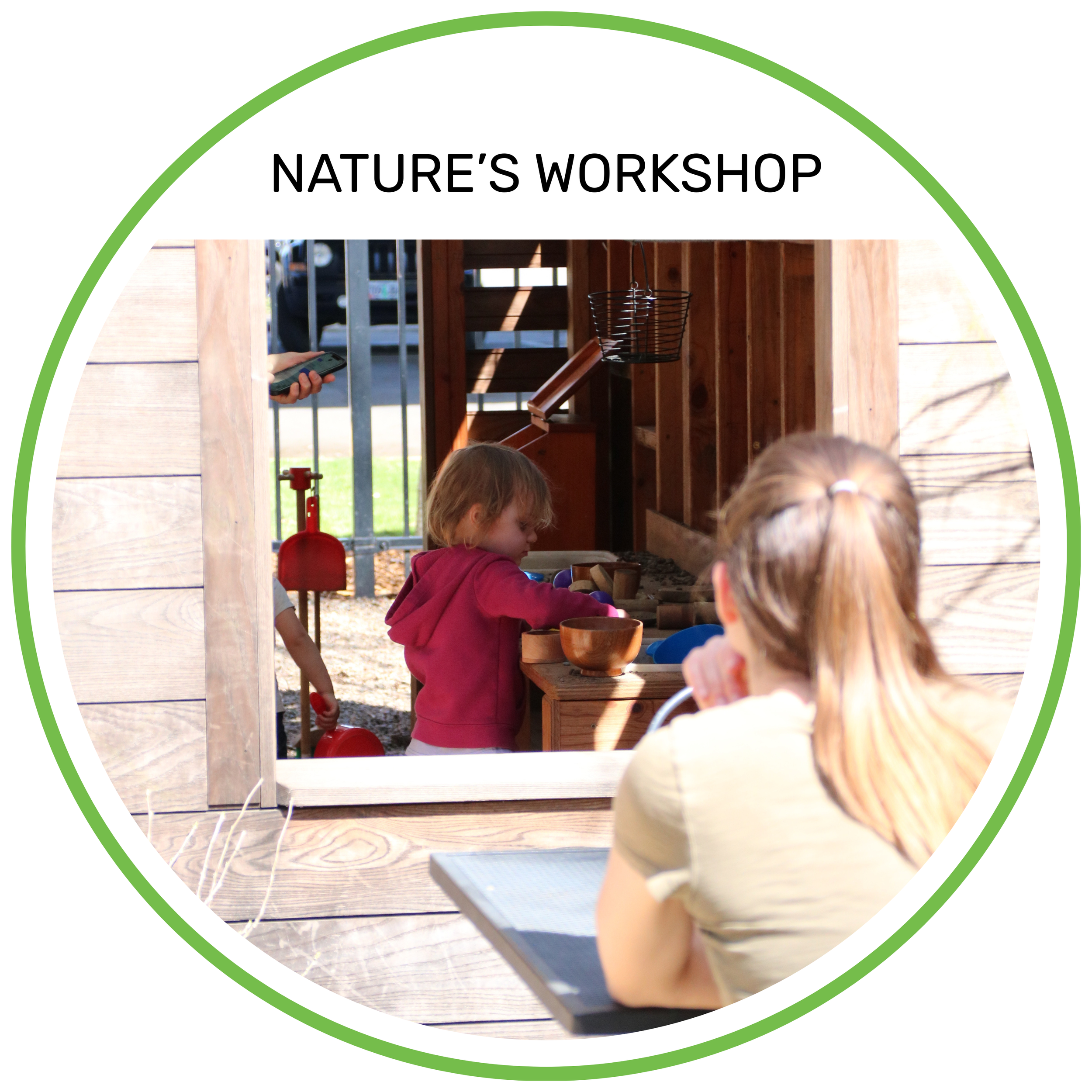 Children playing in a wooden outdoor playhouse with a woman watching, during daytime.