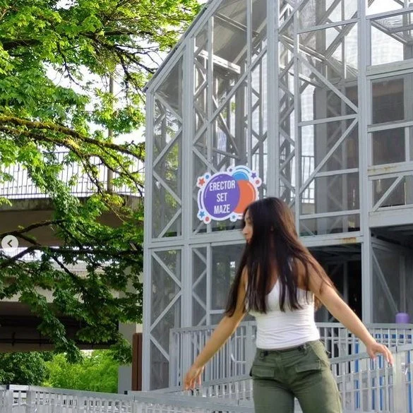 A high school graduate poses by the Erector Set Maze during a private evening rental at the museum.