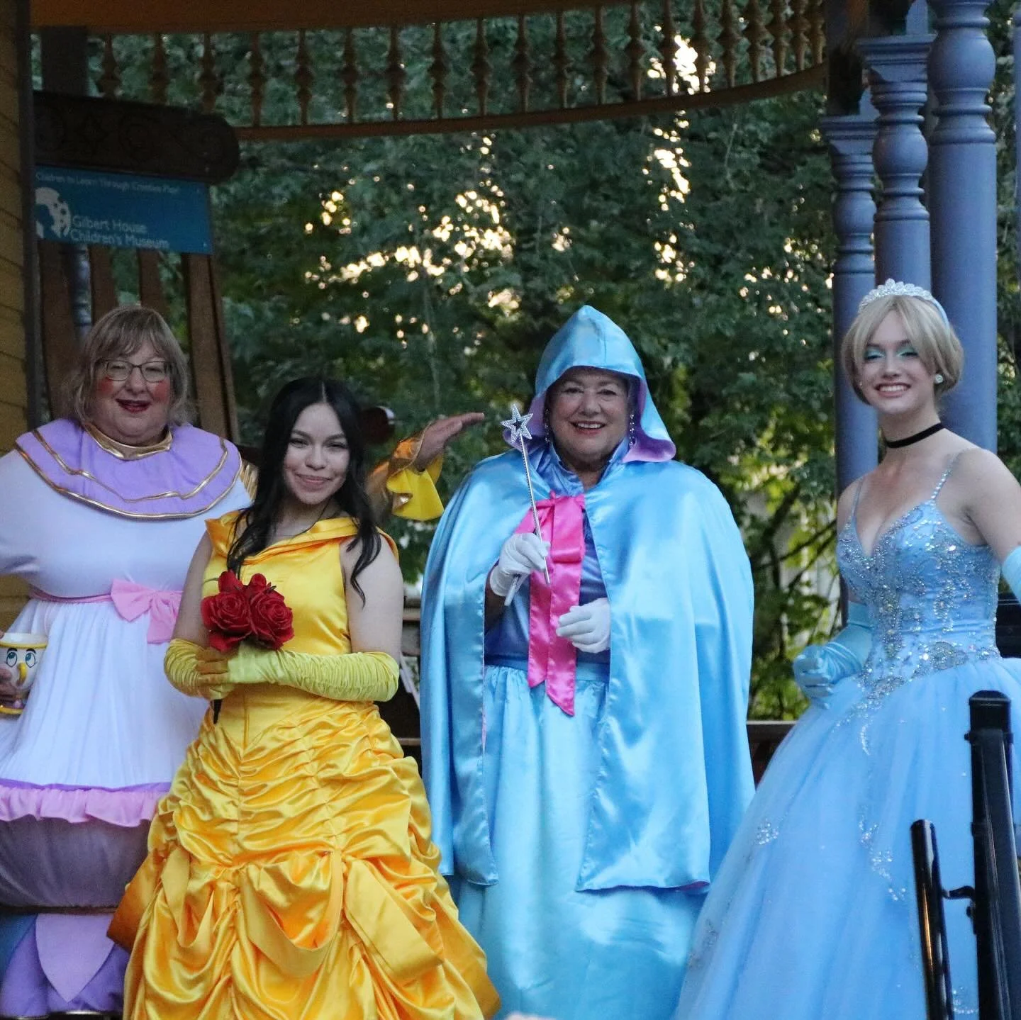 Cinderella, Belle, and the Fairy Godmother characters in full costume for a private Storybook Adventure rental.