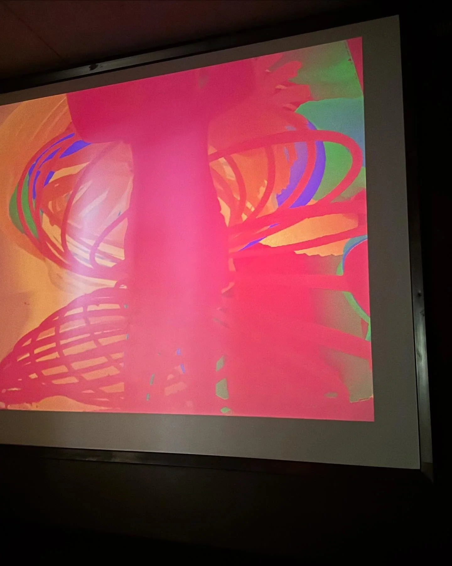 Colorful abstract digital art with swirling lines in pink, orange, green, and blue.