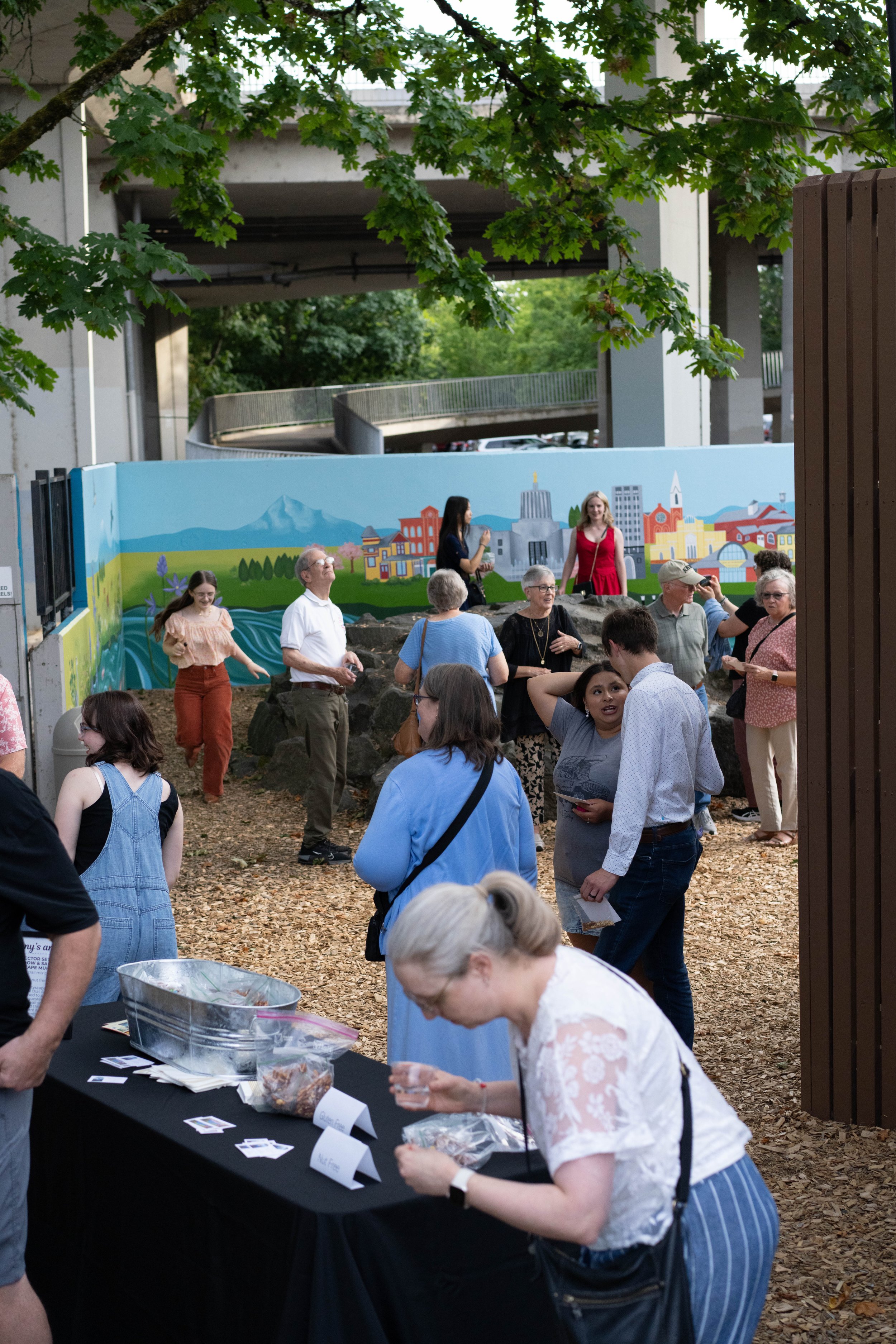 Catered outdoor buffet for the internship reception celebrating student creative work and mural designs.
