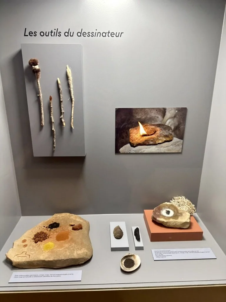 Tools from the era the paintings were made, including a tallow lamp like the painter(s) would have used