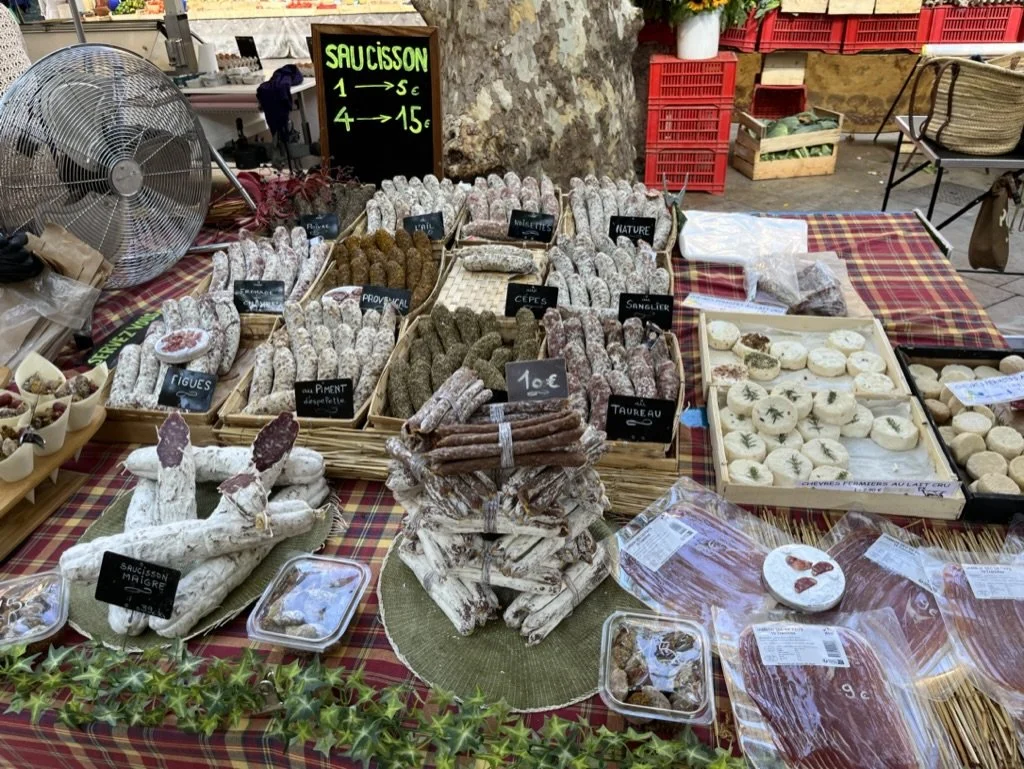 Farmers market in the square around Fontaine de l'eau bénite