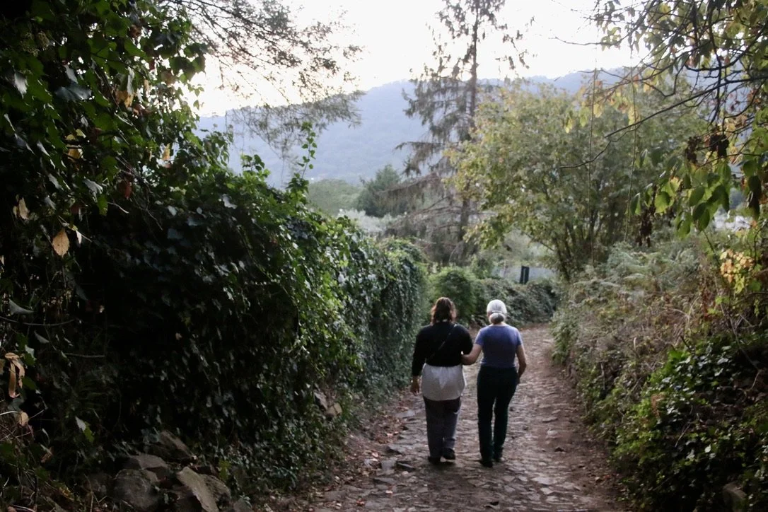 Margaret and Romeo walking arm in arm