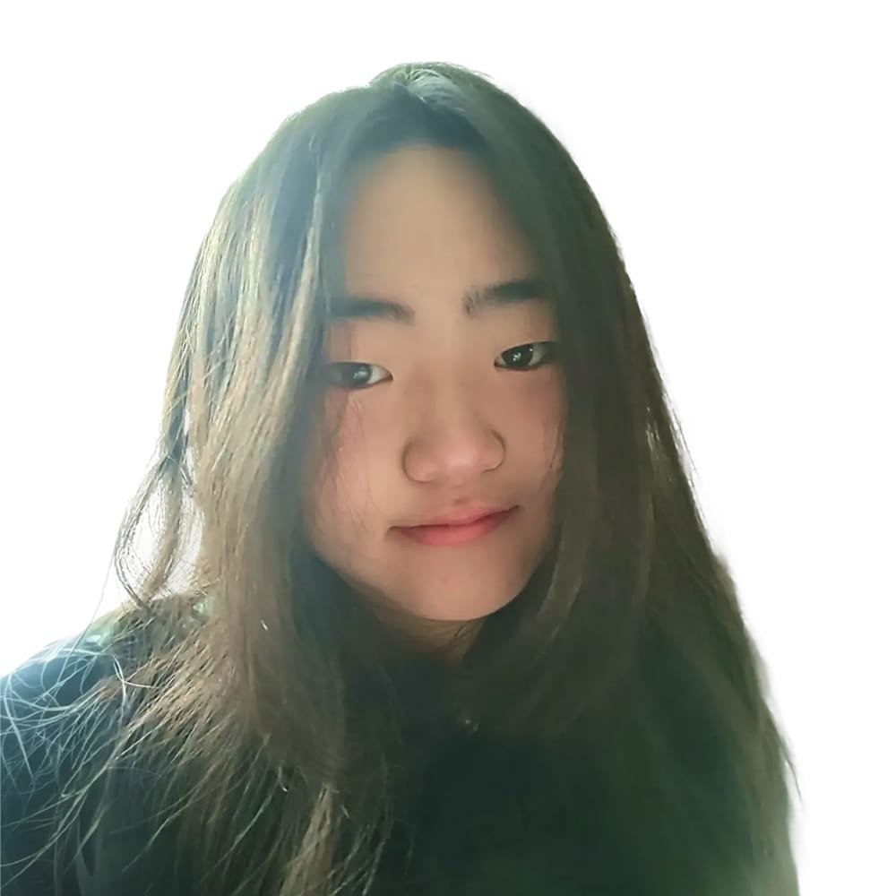 A young woman with long, dark hair, smiling softly, with bright lighting behind her.