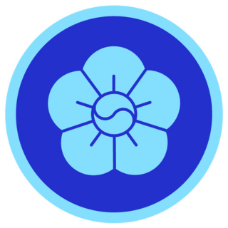 Blue circular emblem with a stylized flower design, featuring six petals and a central swirl, outlined in dark blue.