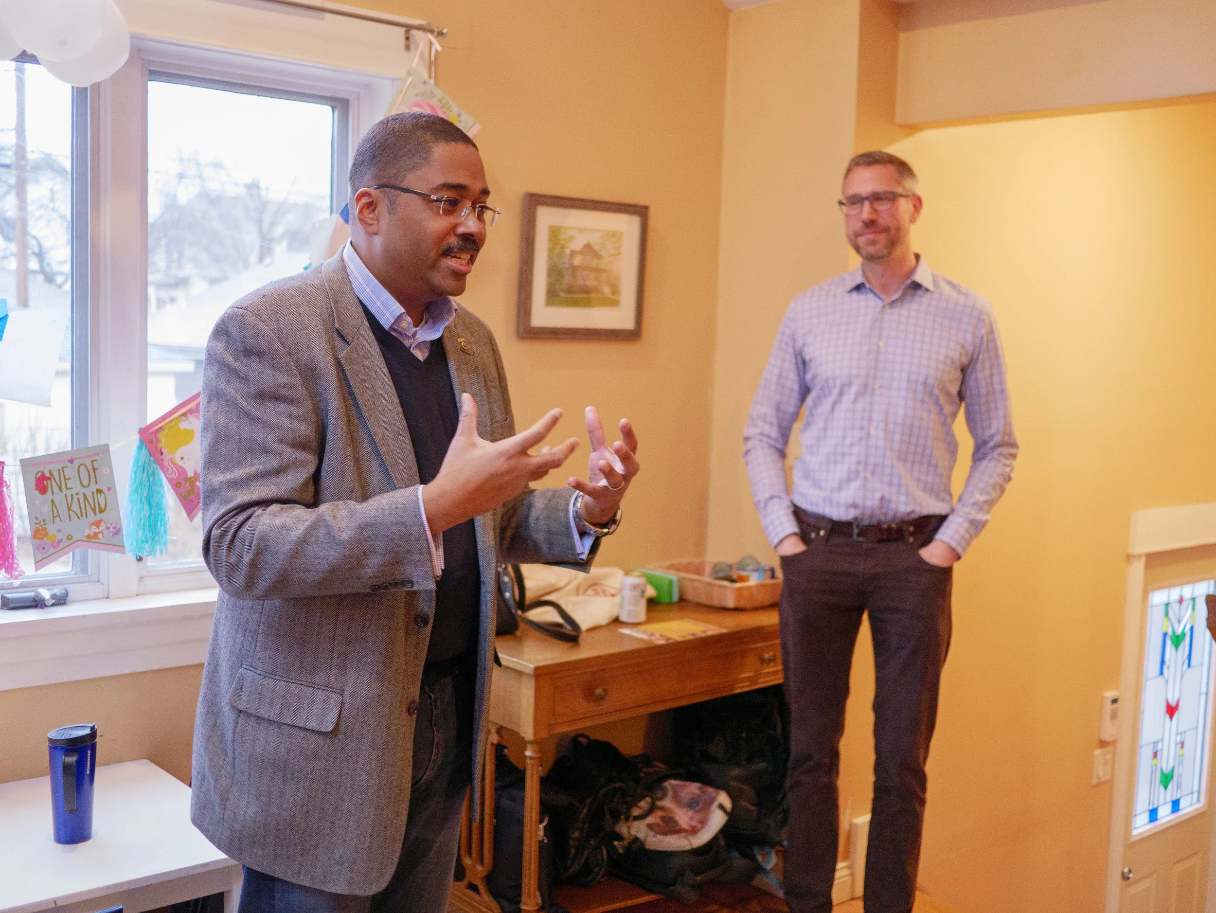 Thomas Gary presenting to a room alongside Treasurer Michael Freirechs