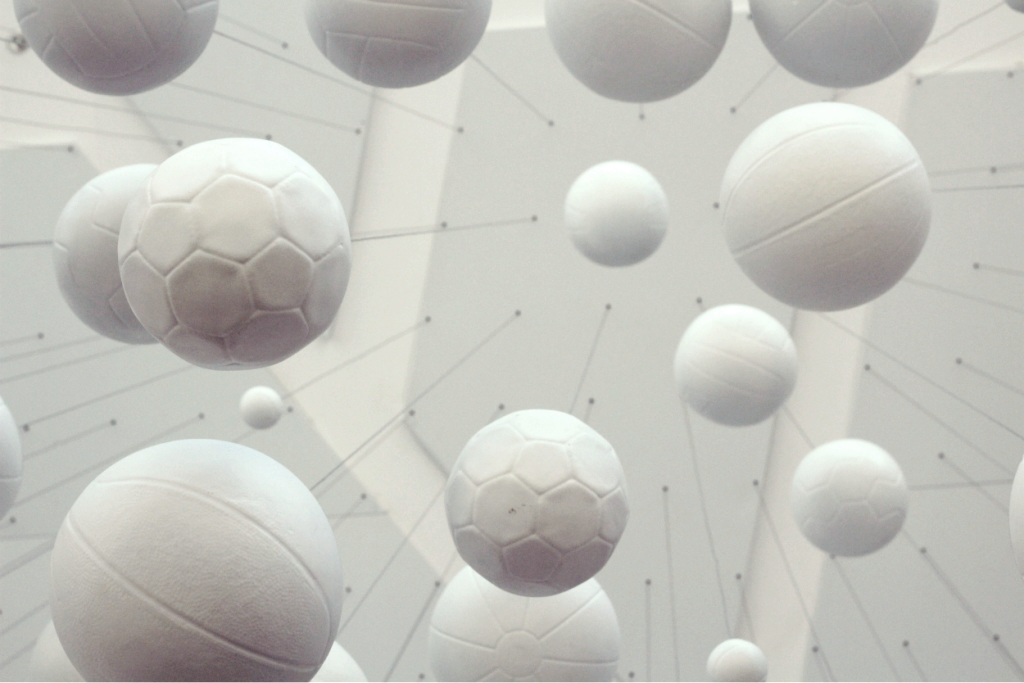 Vários globos brancos de diferentes tamanhos e texturas flutuando no espaço com linhas finas conectando-os.