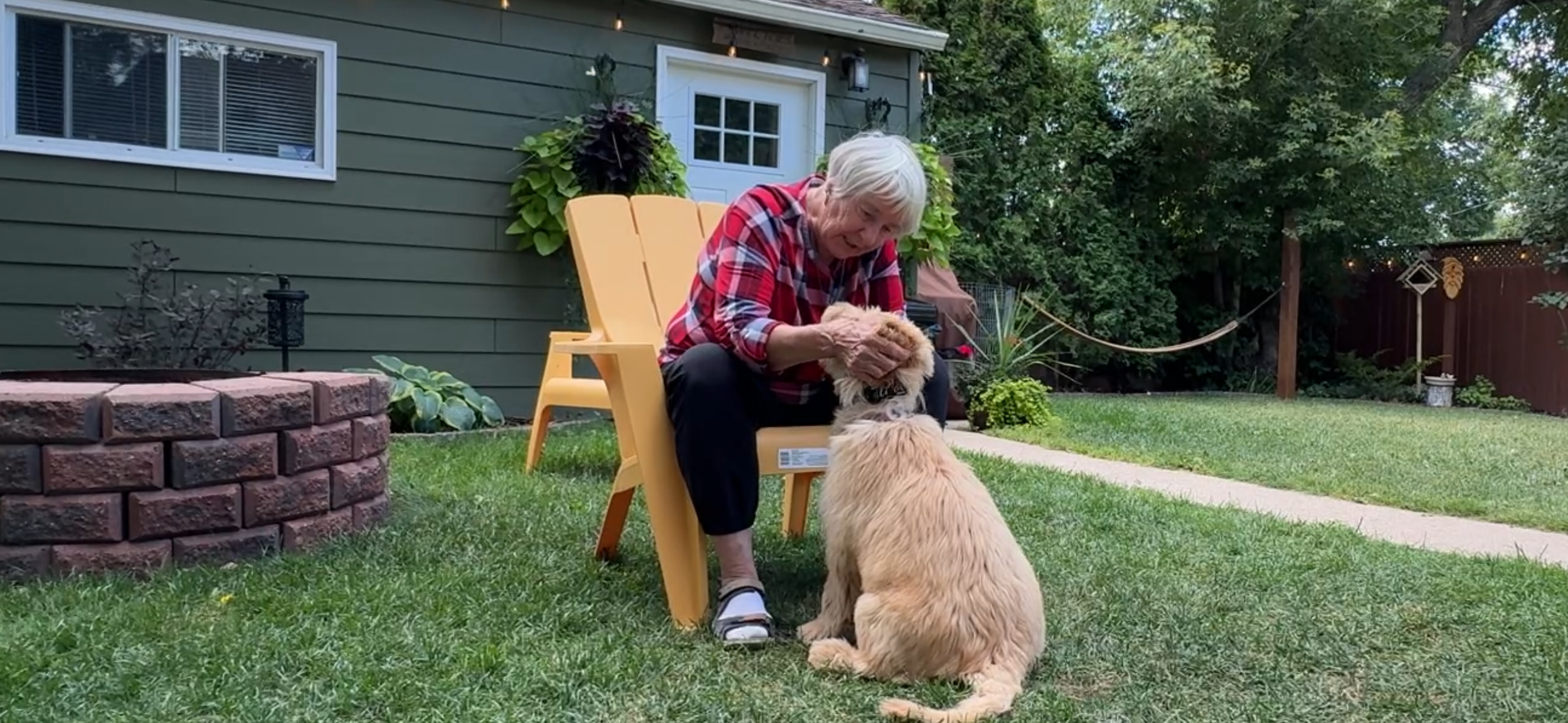 Jen the Trainer and Puppy Olive at Headstart in-home puppy session in Saskatoon.Gentle hold to prevent nipping & biting behavior
