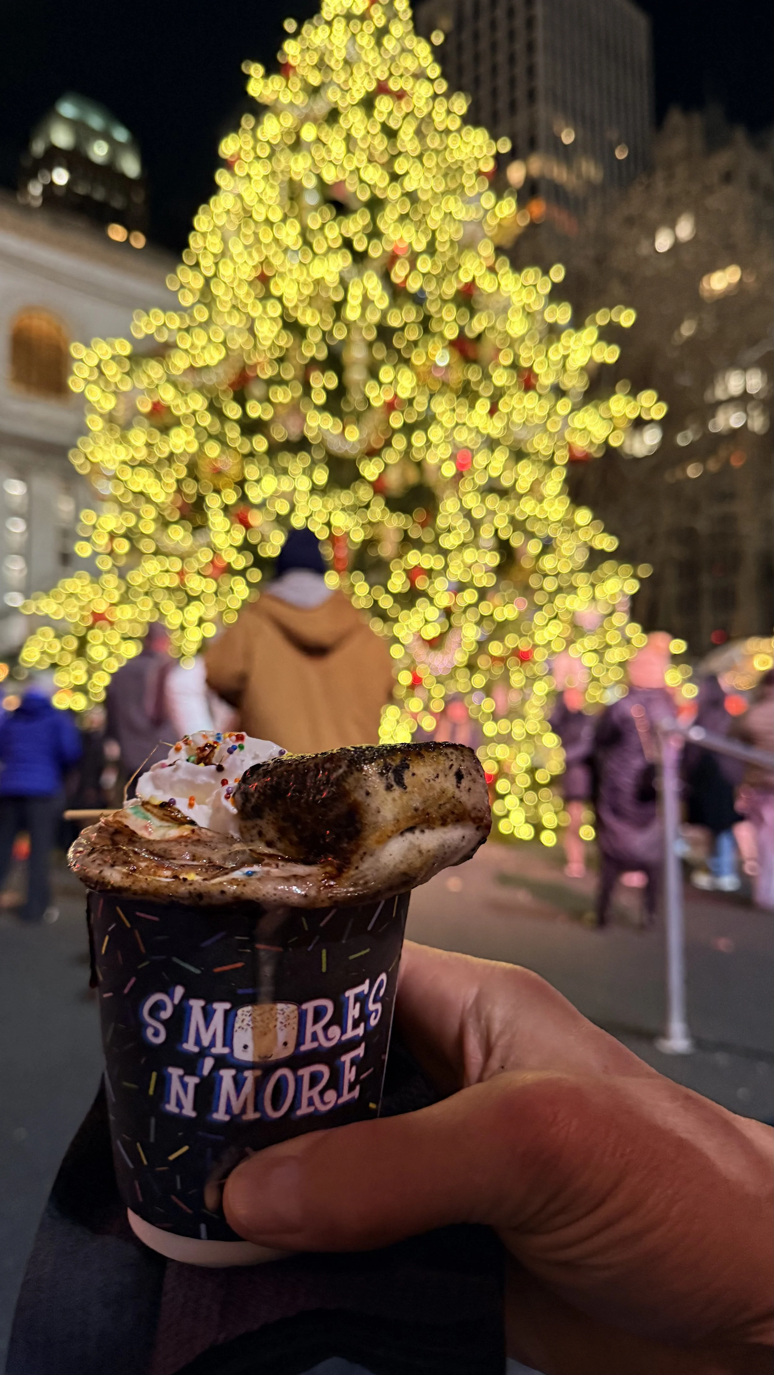 Hot Chocolate with Bryant Park Christmas Tree in the background