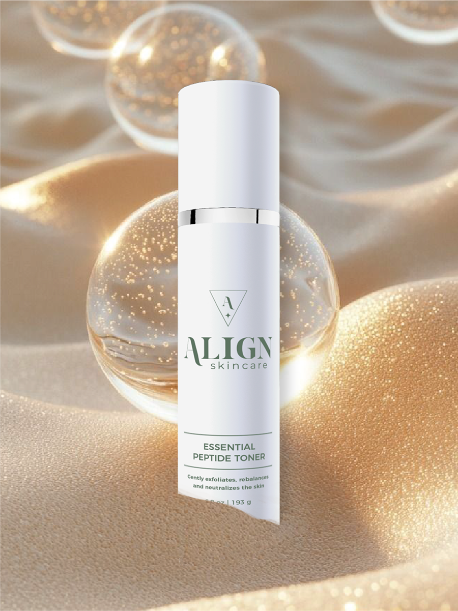 A skincare product labeled 'Align Skincare Clarity Toner' in front of a gold and beige background with reflective, decorative bubbles.