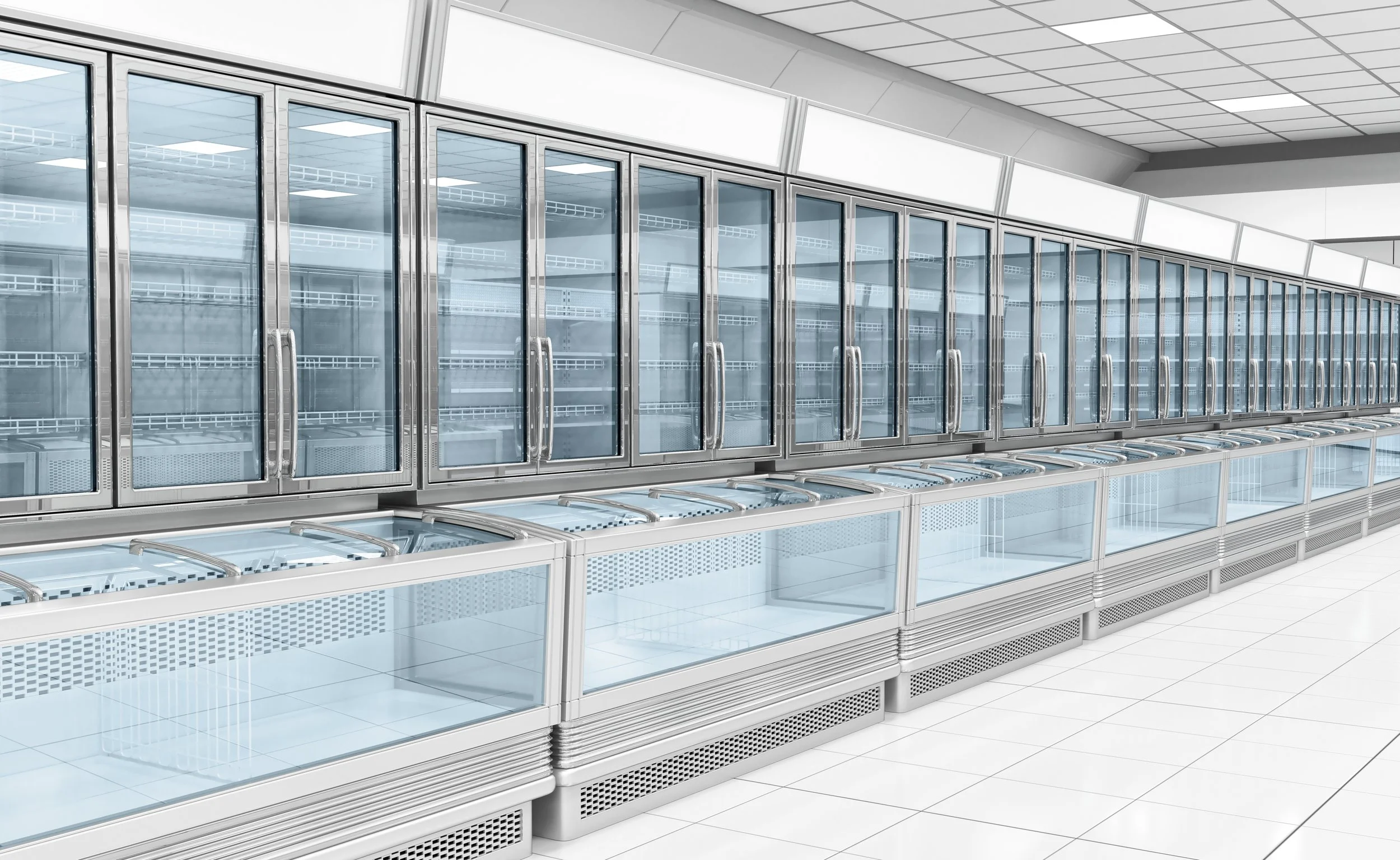 Empty refrigerated display case with glass doors in a store, with some empty shelves inside and additional empty glass display shelves below.