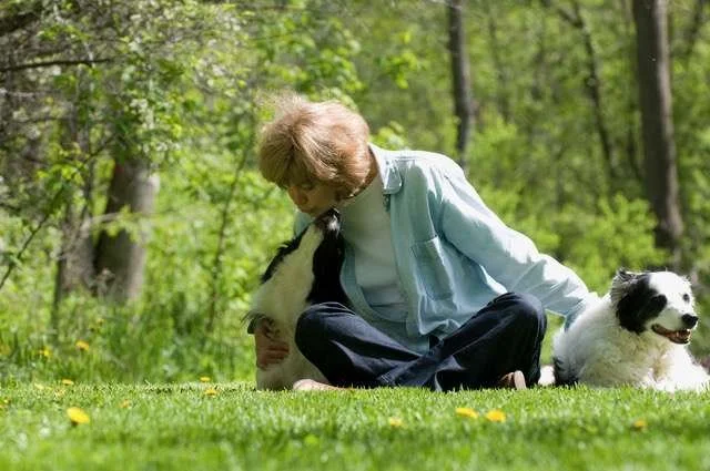 Woman and two dogs outside