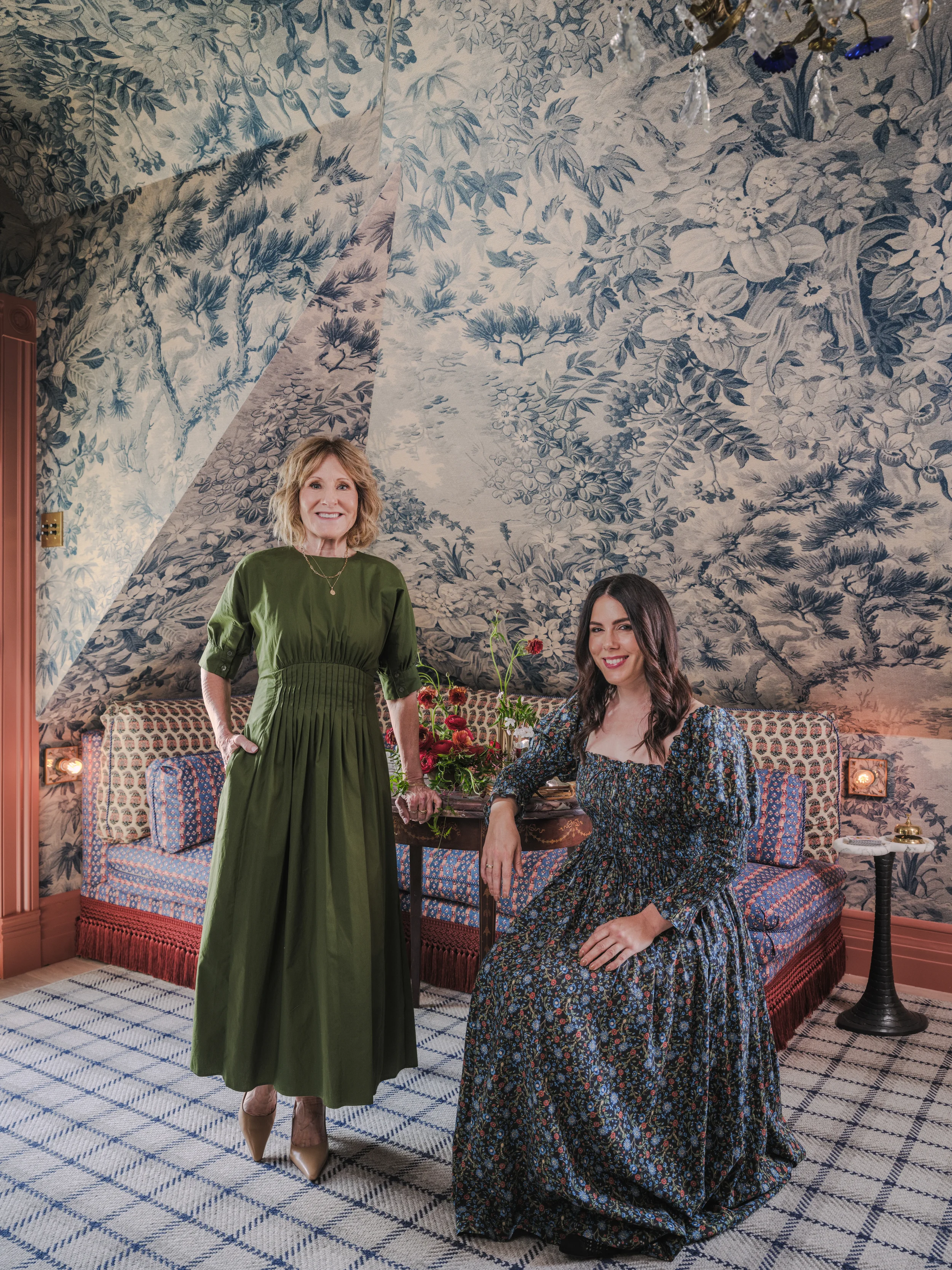 Deborah Costa (left) and Kristine Renee (right) of Jeanne Renee posing in La Chambre Bleue, their renovated room at the San Francisco Decorator Showcase.